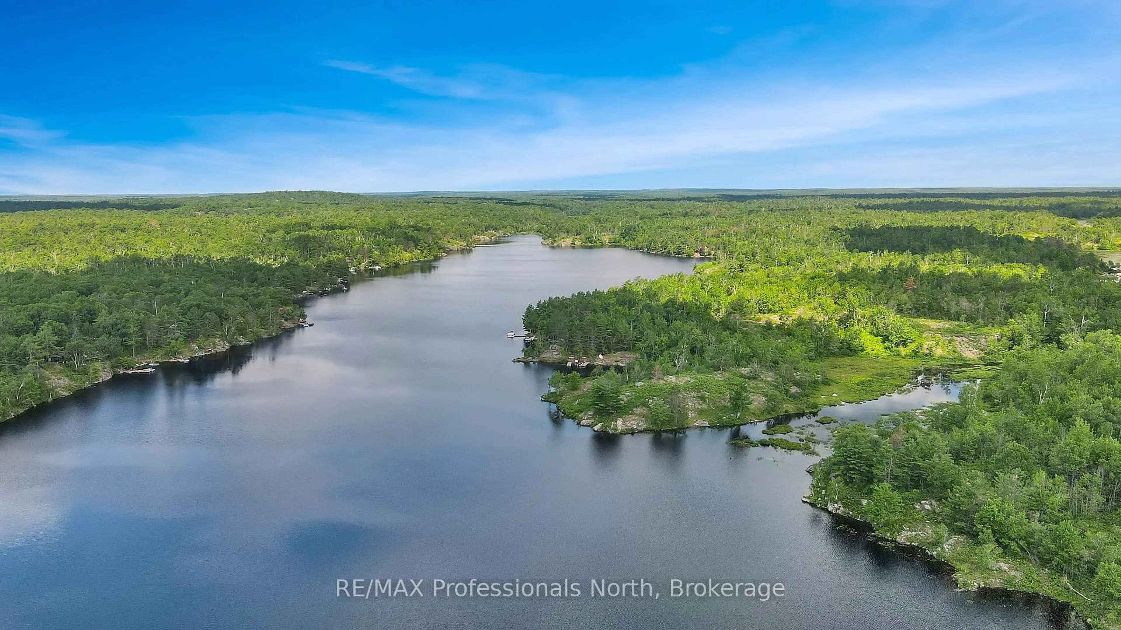 A pic from outside/outdoor area/front of a property/back of a property/a pic from drone, water/lake/river/ocean view for 10549 Devil's Lake WAO, Minden Hills Ontario K0M 2K0