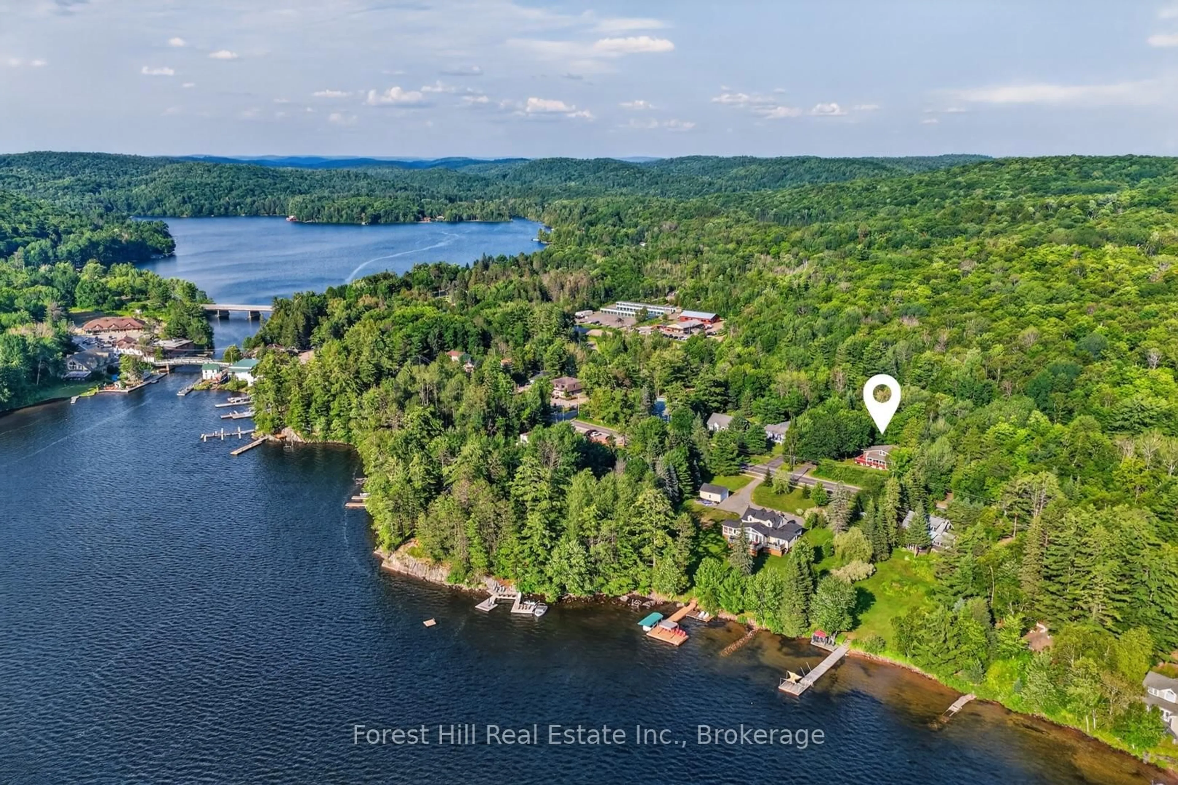 A pic from outside/outdoor area/front of a property/back of a property/a pic from drone, water/lake/river/ocean view for 1117 Main St, Algonquin Highlands Ontario P0A 1E0