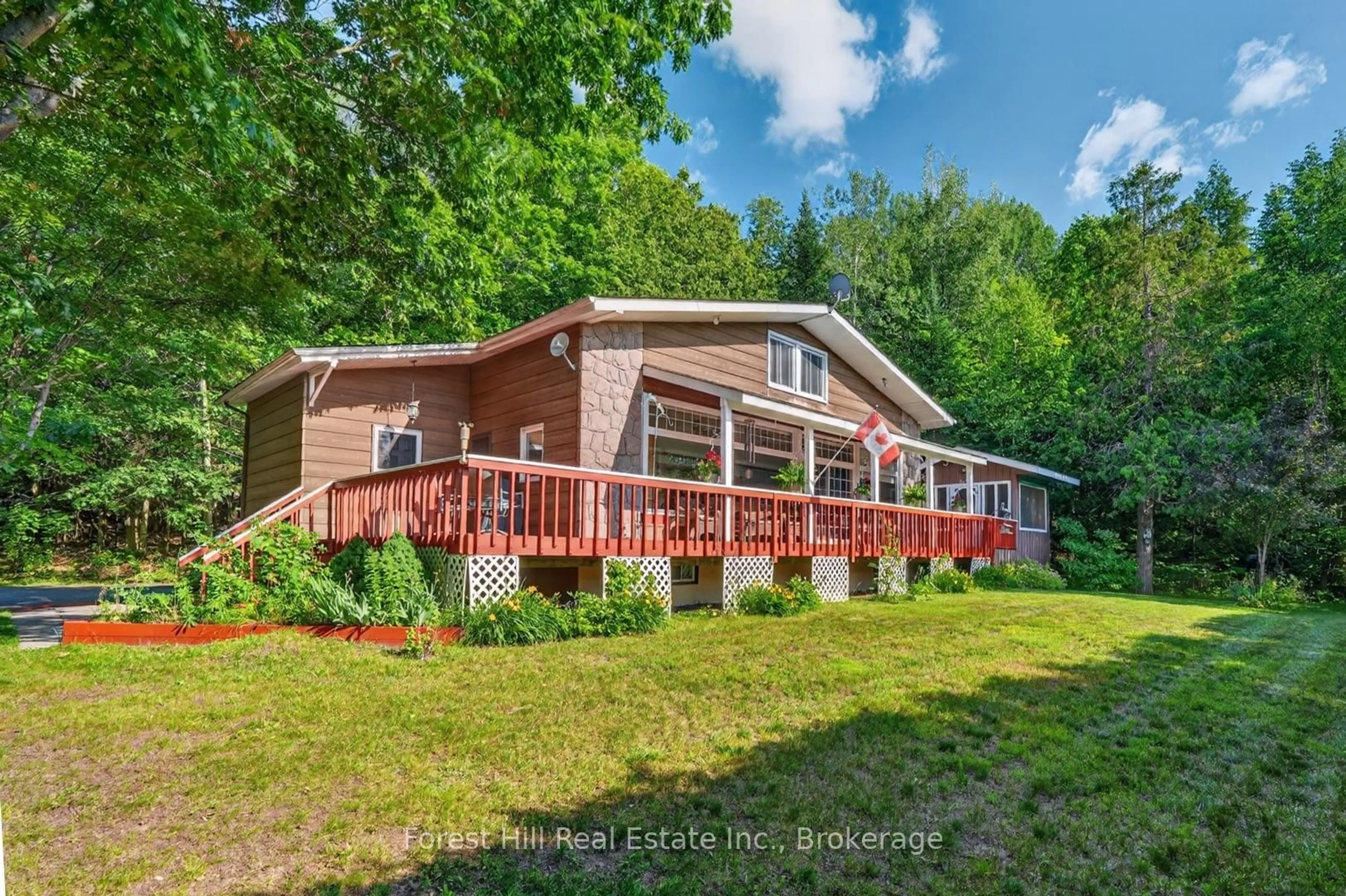 A pic from outside/outdoor area/front of a property/back of a property/a pic from drone, water/lake/river/ocean view for 1117 Main St, Algonquin Highlands Ontario P0A 1E0