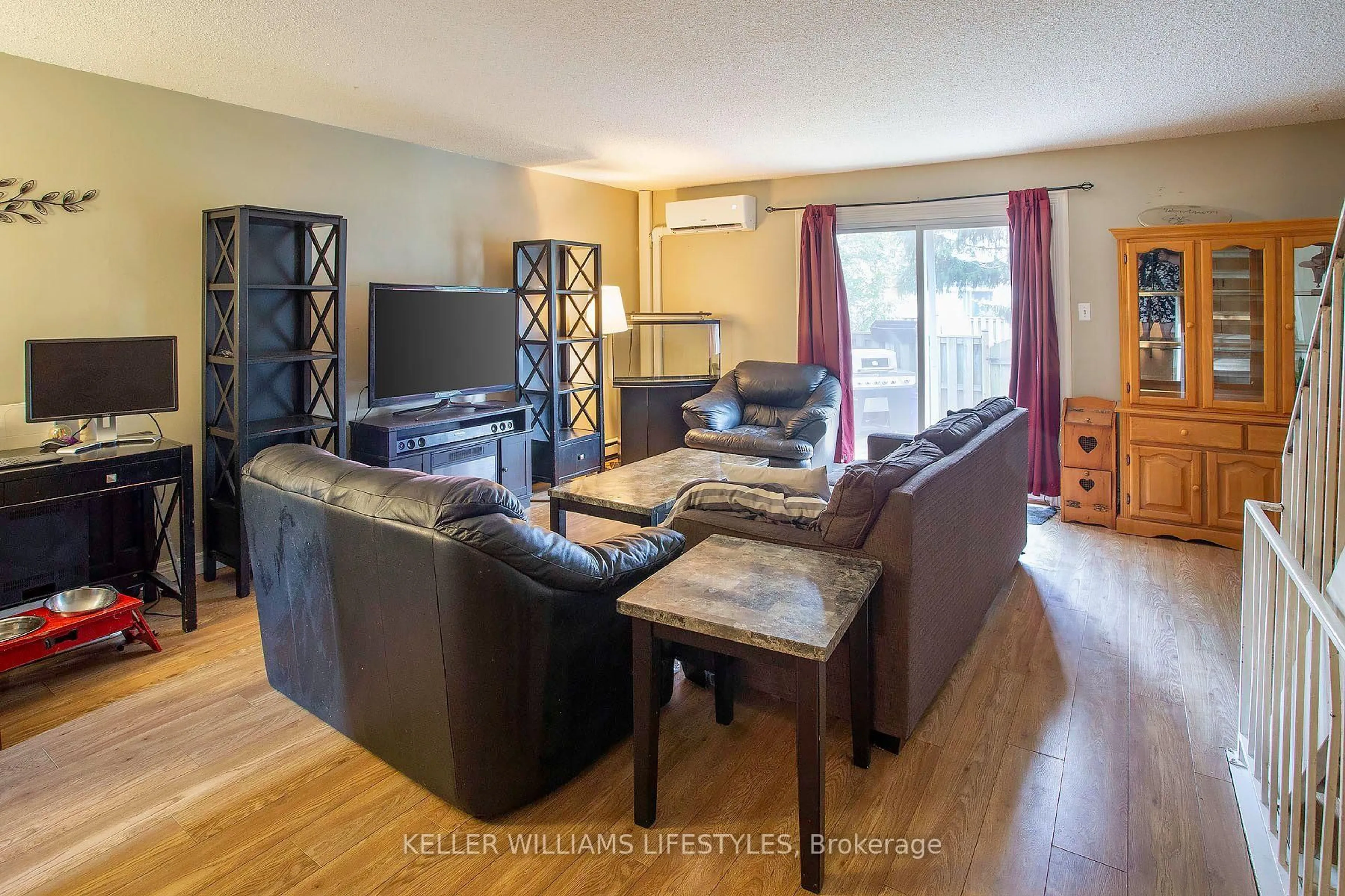 Living room with furniture, wood/laminate floor for 120 Monmore Rd, London North Ontario N6G 3A6
