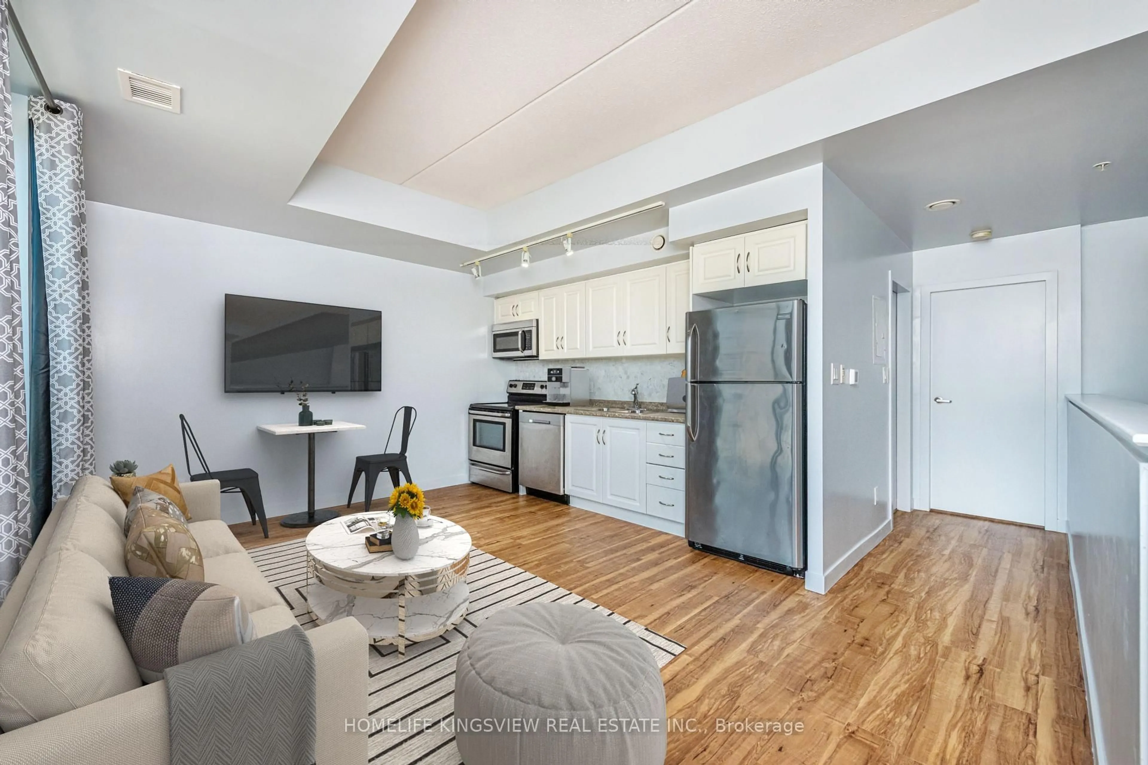 Open concept kitchen, wood/laminate floor for 5 Gordon St #212, Guelph Ontario N1H 4G8