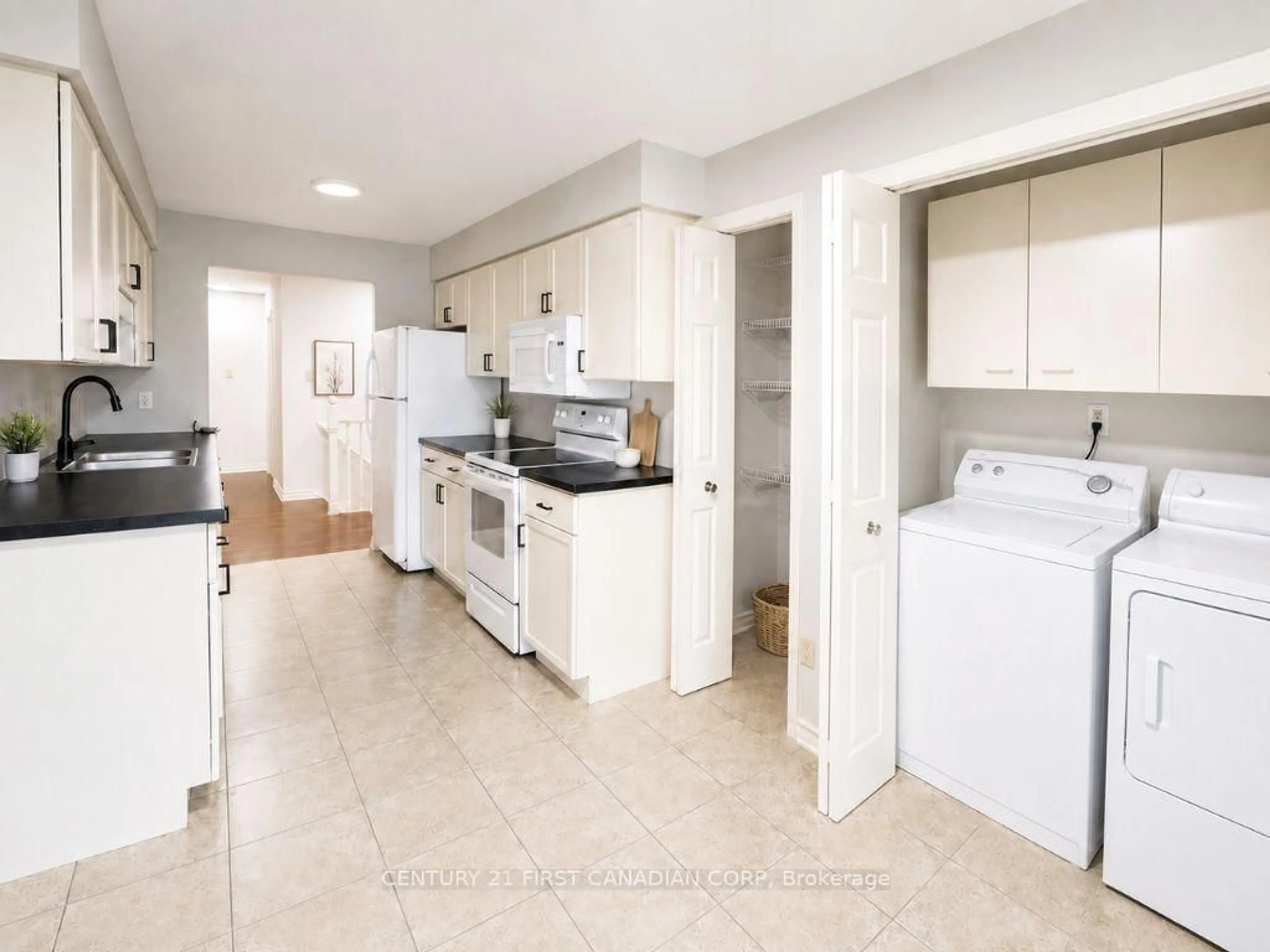Kitchen with laundary machines, ceramic/tile floor for 1500 Richmond St #40, London North Ontario N6G 4T7