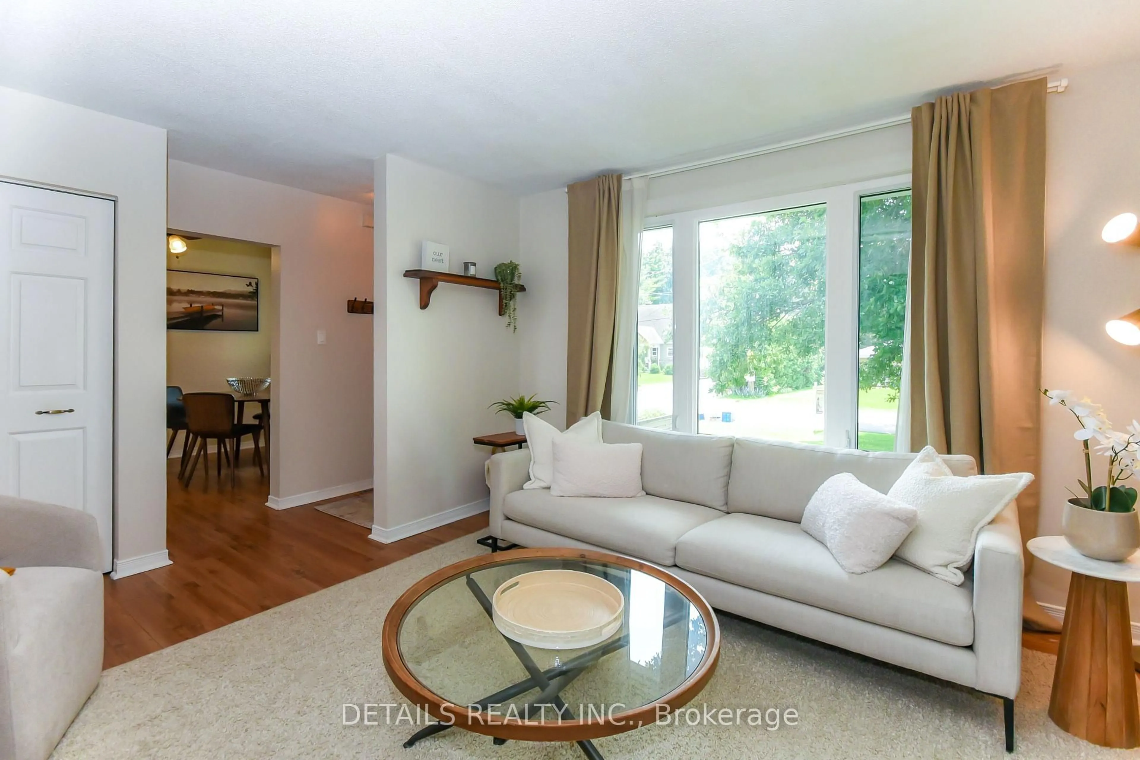 Living room with furniture, wood/laminate floor for 22 Colonel Murray St, Richmond Ontario K0A 2Z0