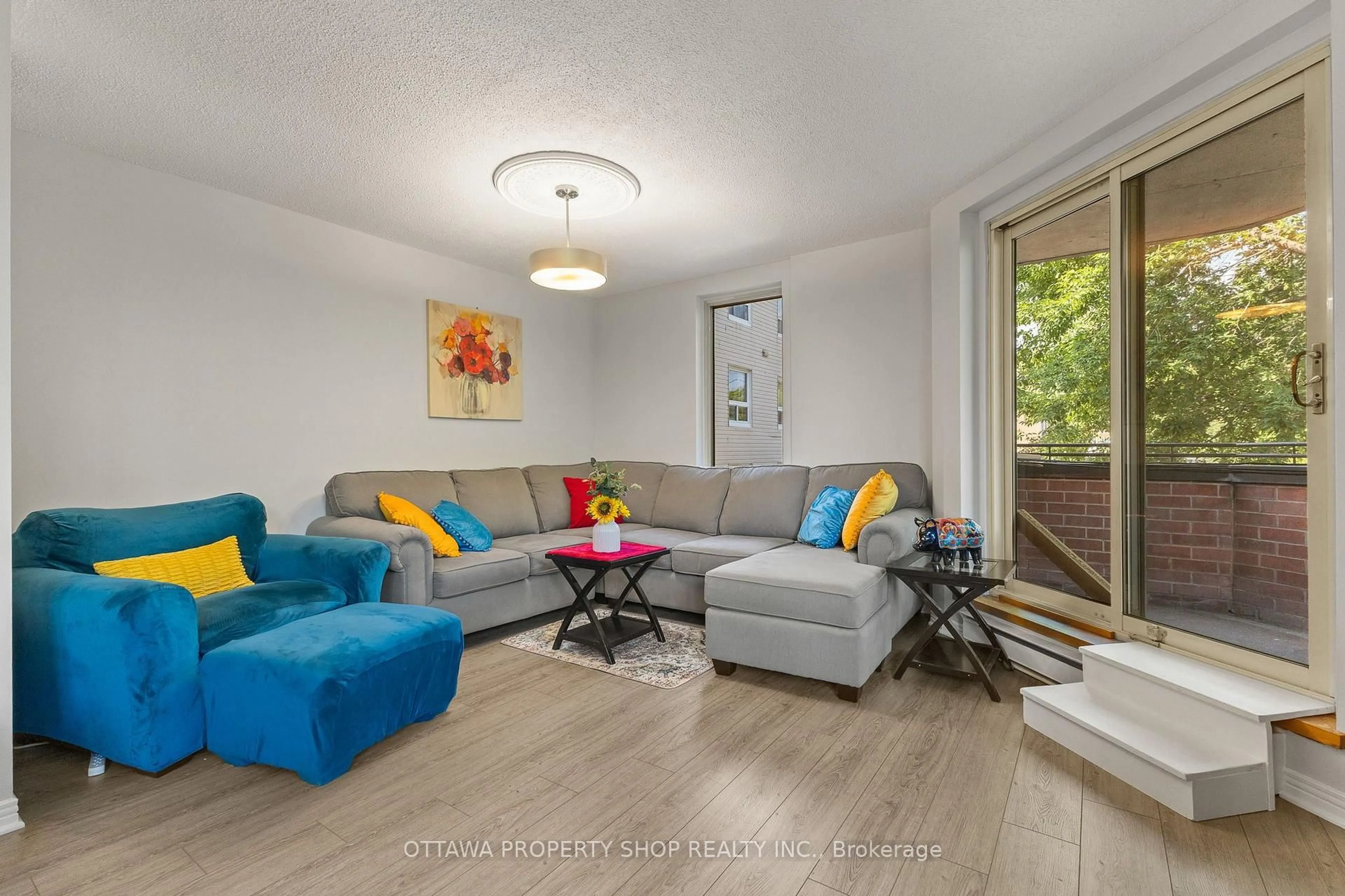 Living room with furniture, wood/laminate floor for 800 Mckellar Ave #204, Ottawa Ontario K2A 2X5