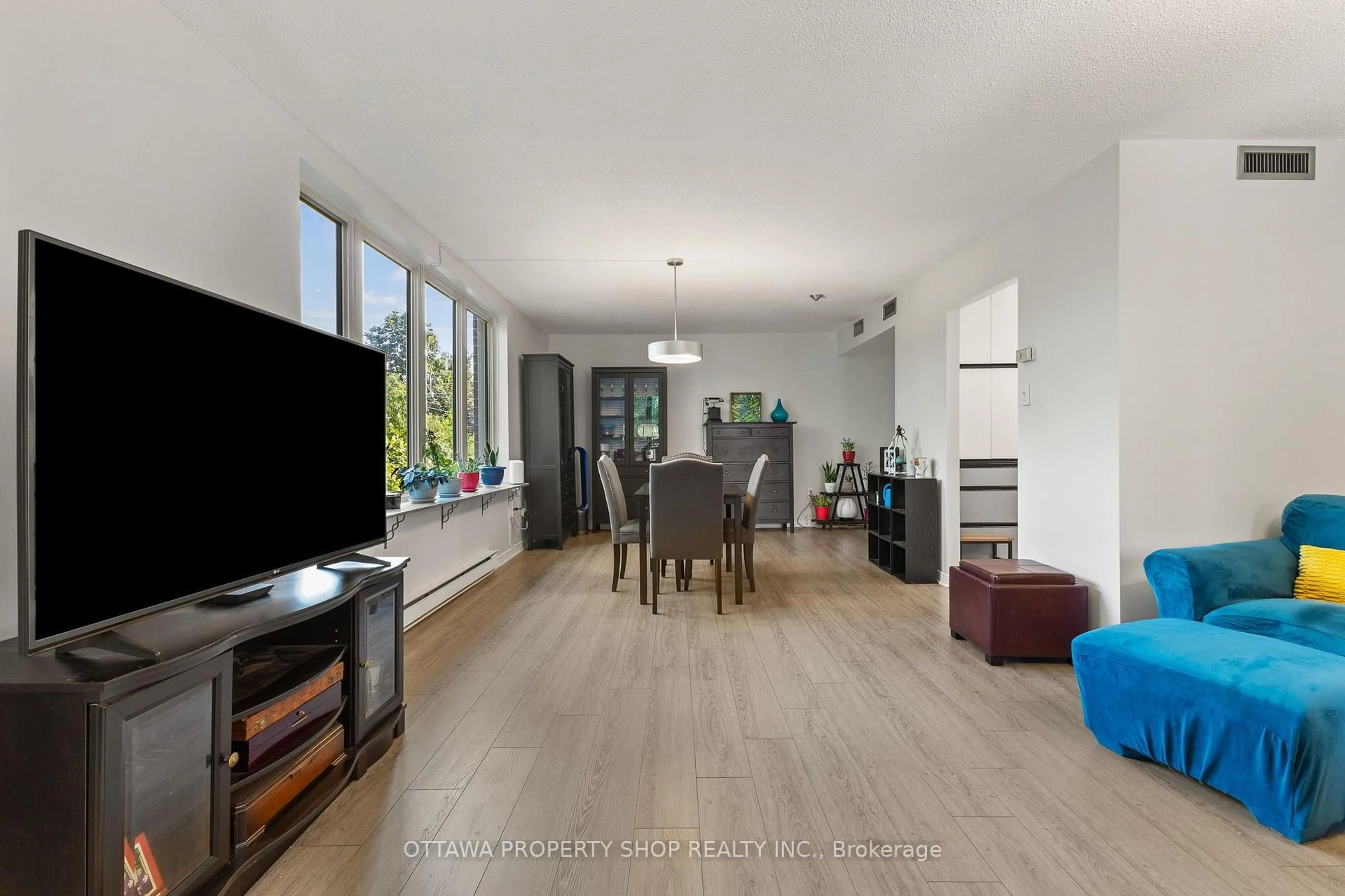 Living room with furniture, wood/laminate floor for 800 Mckellar Ave #204, Ottawa Ontario K2A 2X5