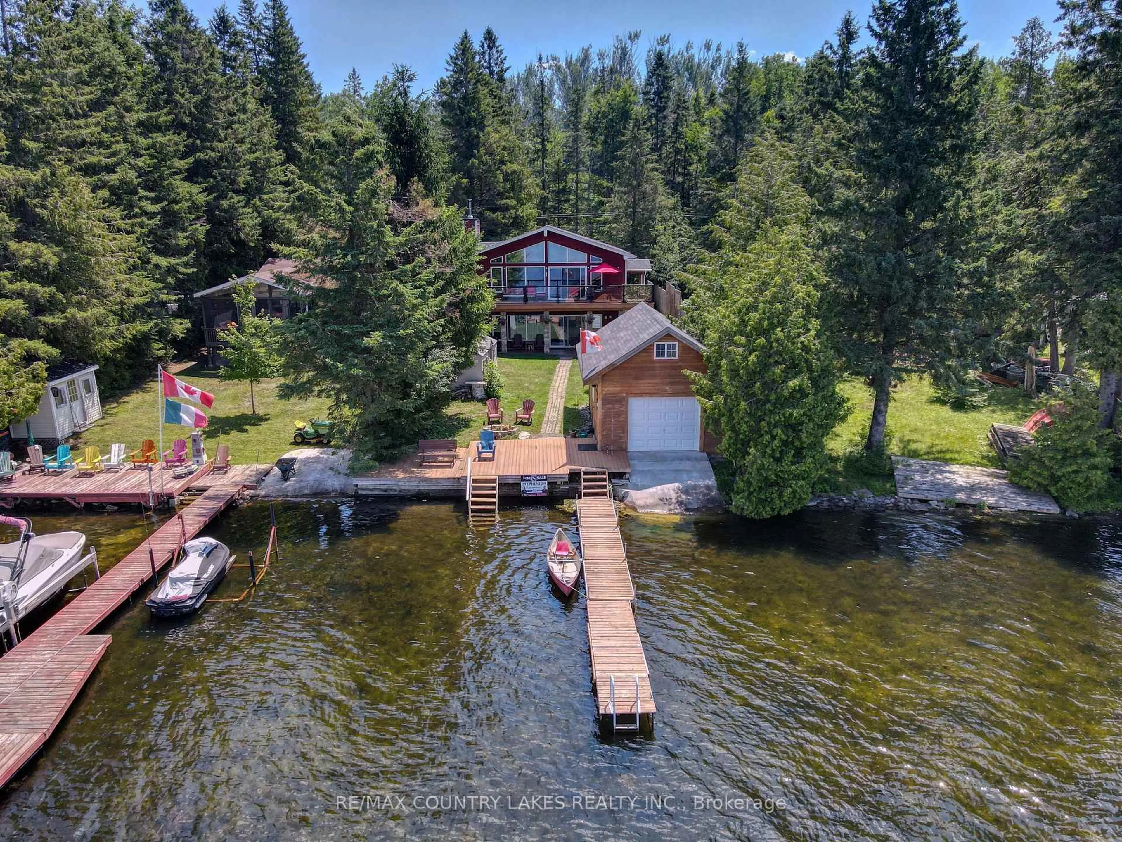 A pic from outside/outdoor area/front of a property/back of a property/a pic from drone, water/lake/river/ocean view for 87 Paradise Rd, Kawartha Lakes Ontario K0M 1B0