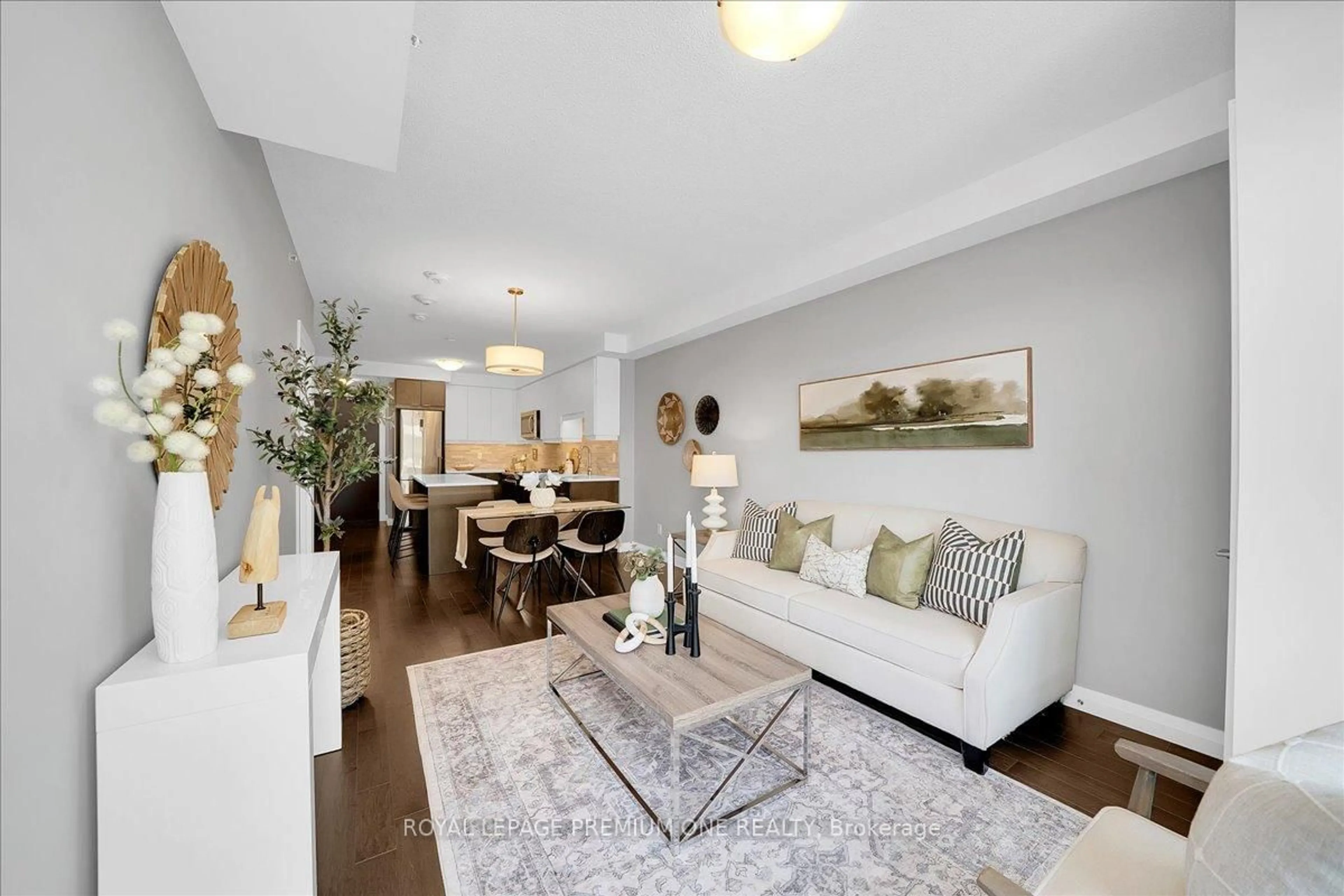 Living room with furniture, wood/laminate floor for 63 Arthur St #611, Guelph Ontario N1E 5K2
