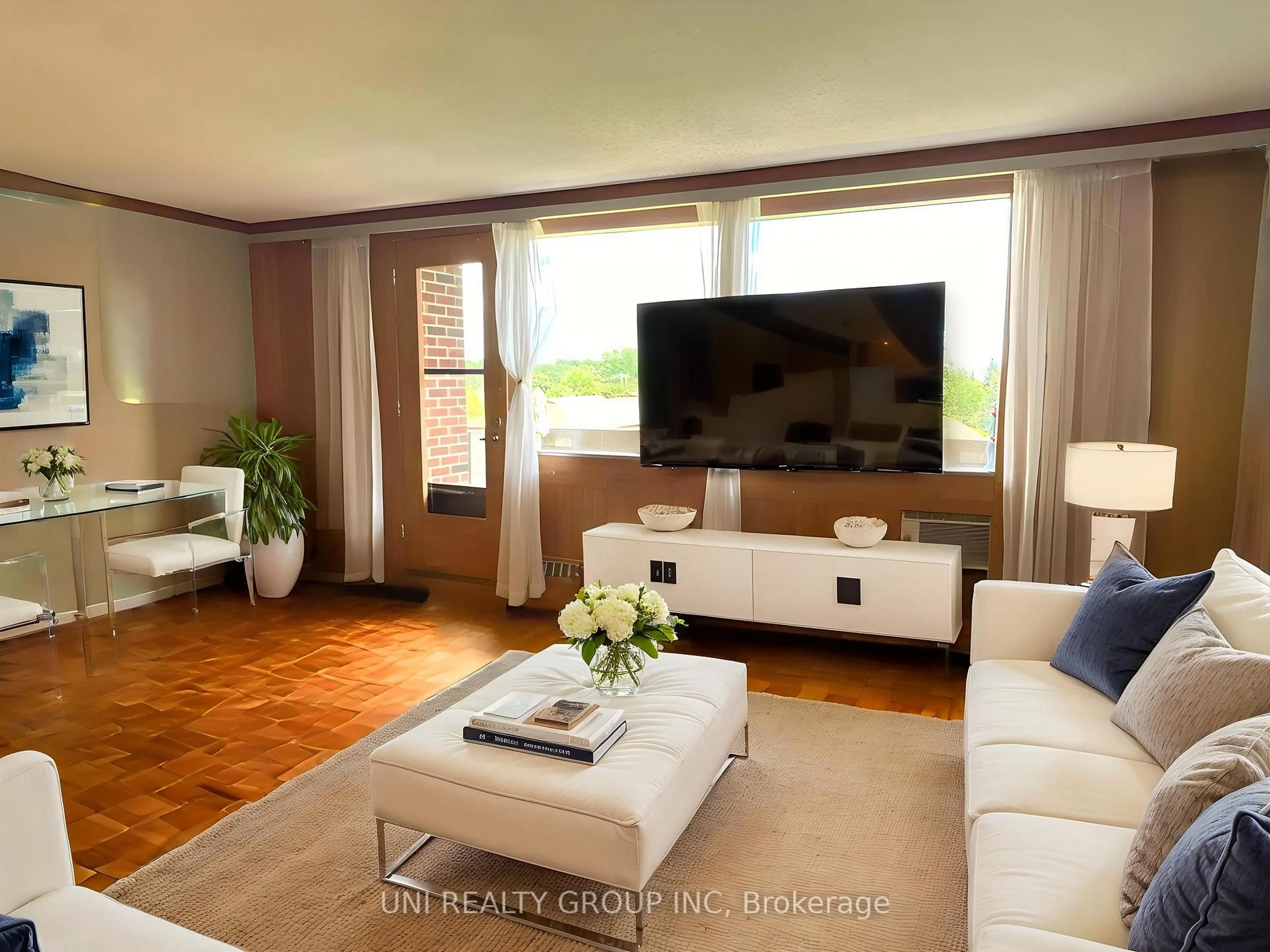 Living room with furniture, wood/laminate floor for 3100 CARLING Ave #417, Ottawa Ontario K2B 6J6