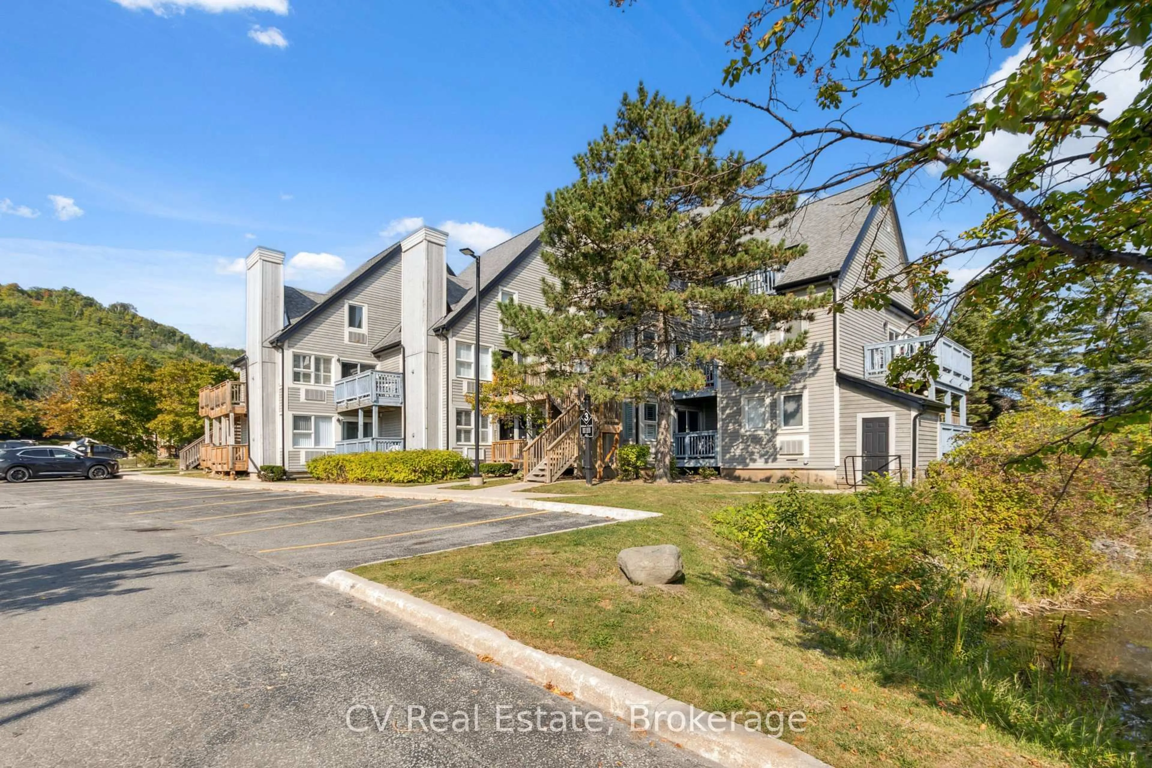 A pic from outside/outdoor area/front of a property/back of a property/a pic from drone, unknown for 796468 Grey 19 Rd #307, Blue Mountains Ontario L9Y 0N6