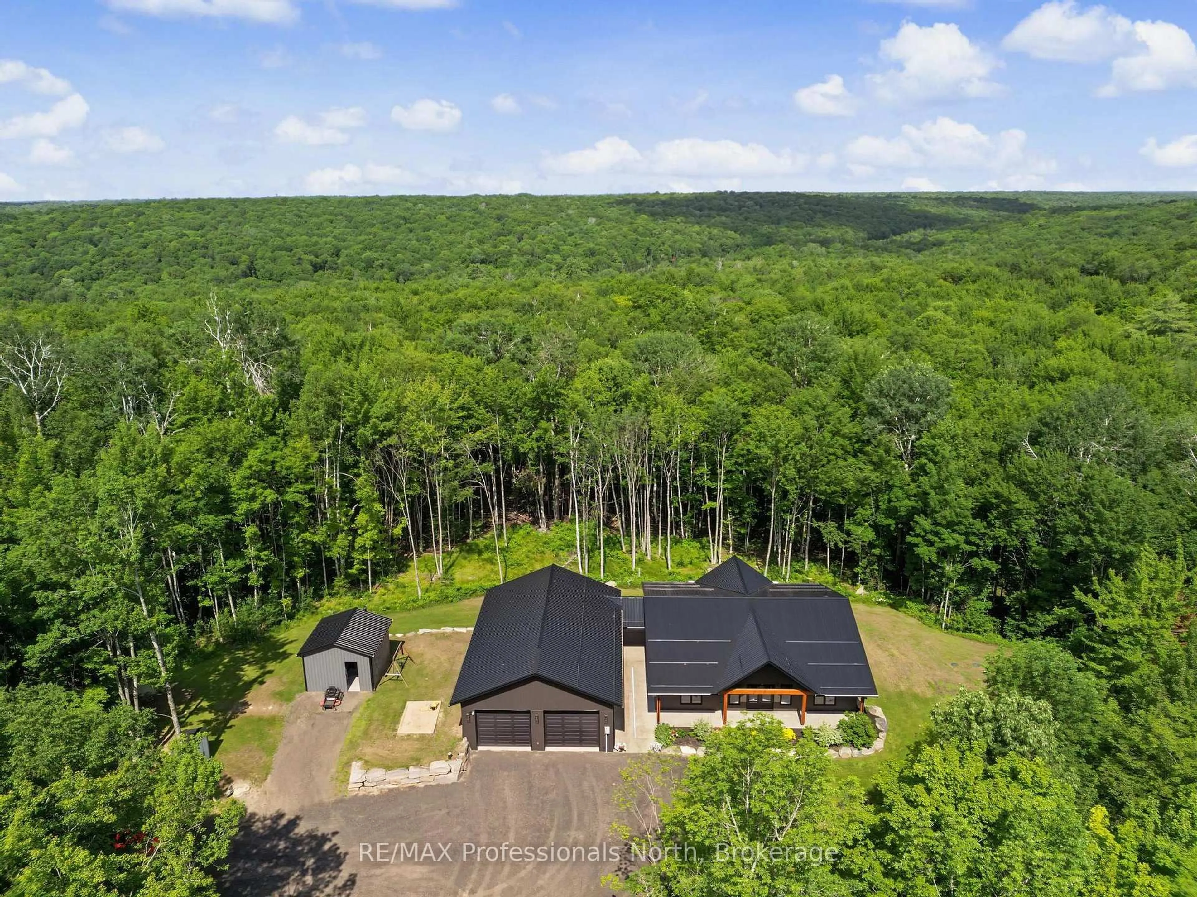 A pic from outside/outdoor area/front of a property/back of a property/a pic from drone, forest/trees view for 1541 Bobcaygeon Rd, Minden Hills Ontario K0M 2K0