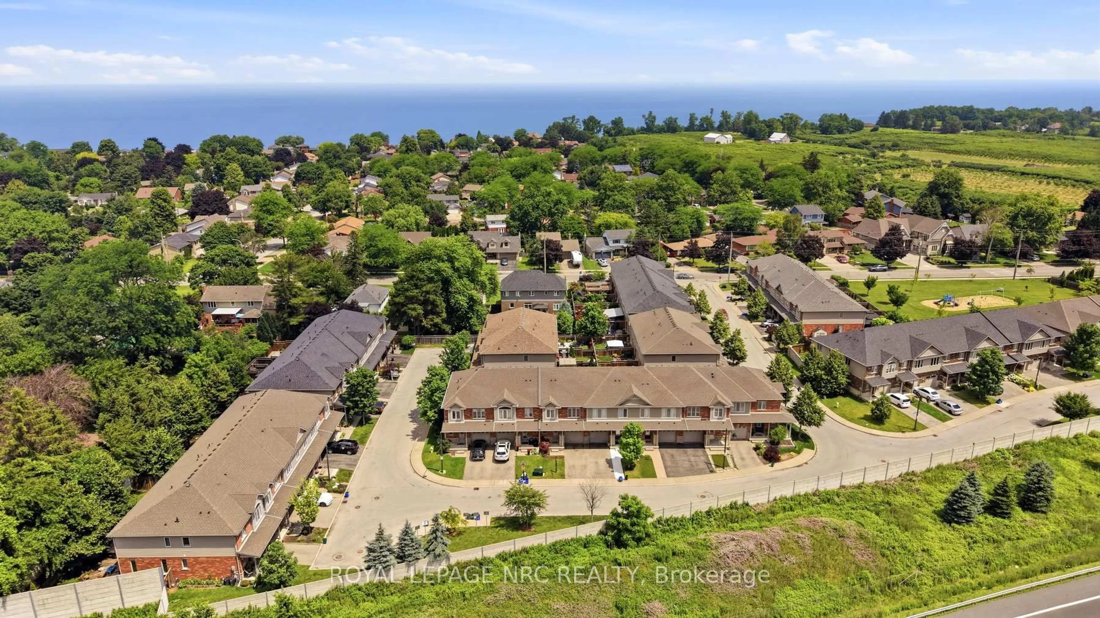 A pic from outside/outdoor area/front of a property/back of a property/a pic from drone, water/lake/river/ocean view for 380 Lake St #14, Grimsby Ontario L3M 0E8