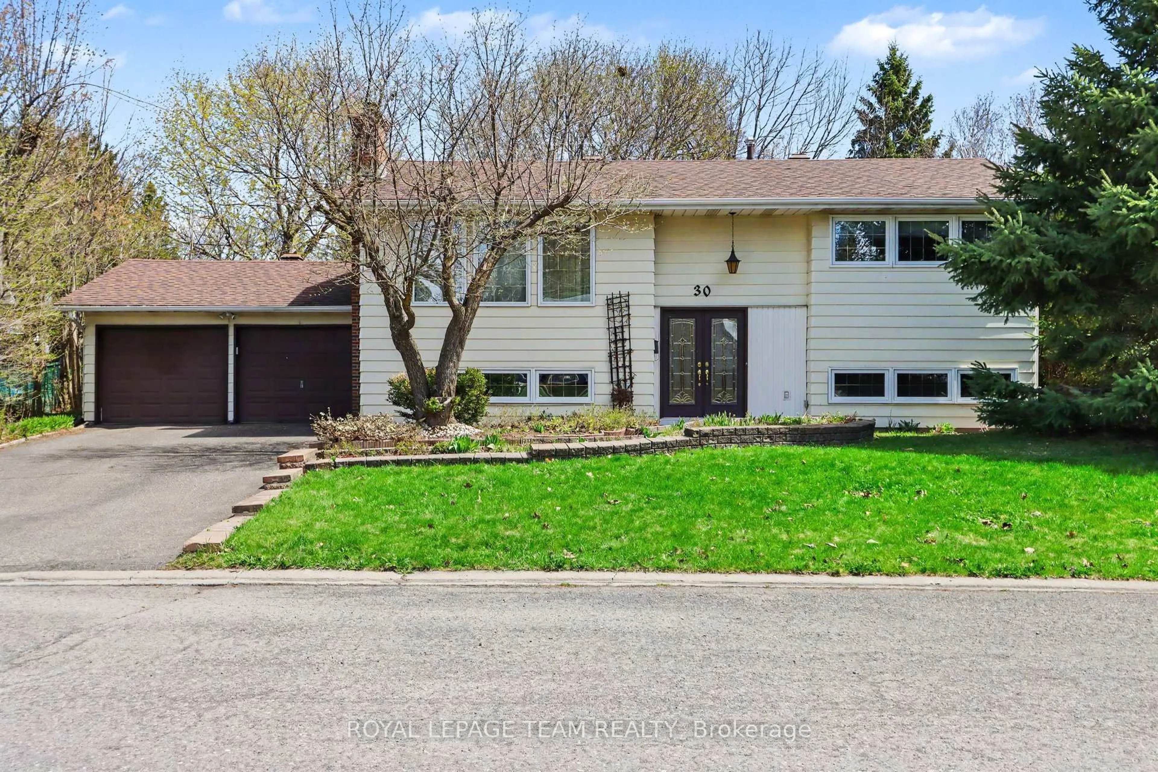 Home with vinyl exterior material, street for 30 Juniper Crt, Ottawa Ontario K2E 5M6