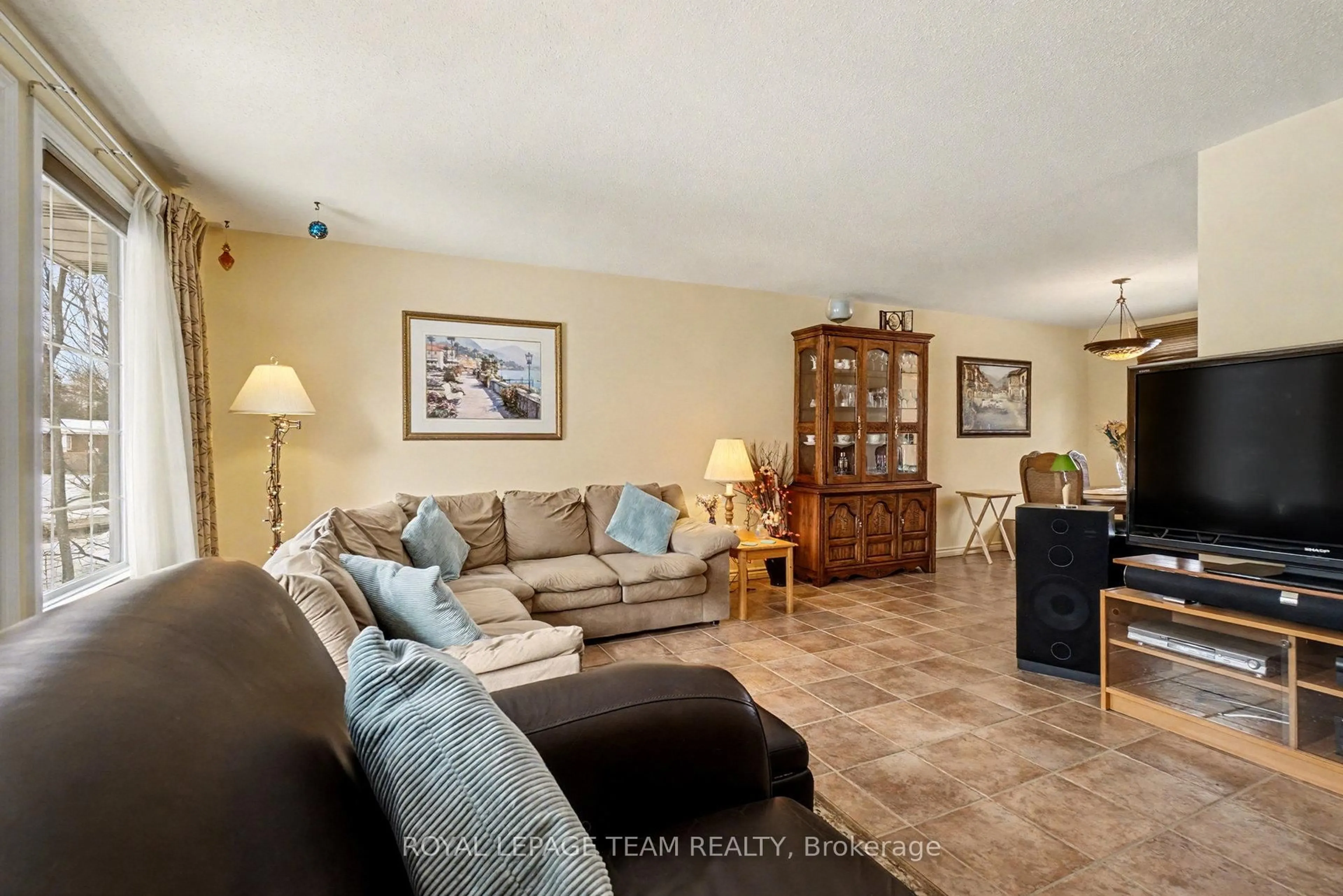 Living room with furniture, ceramic/tile floor for 30 Juniper Crt, Ottawa Ontario K2E 5M6