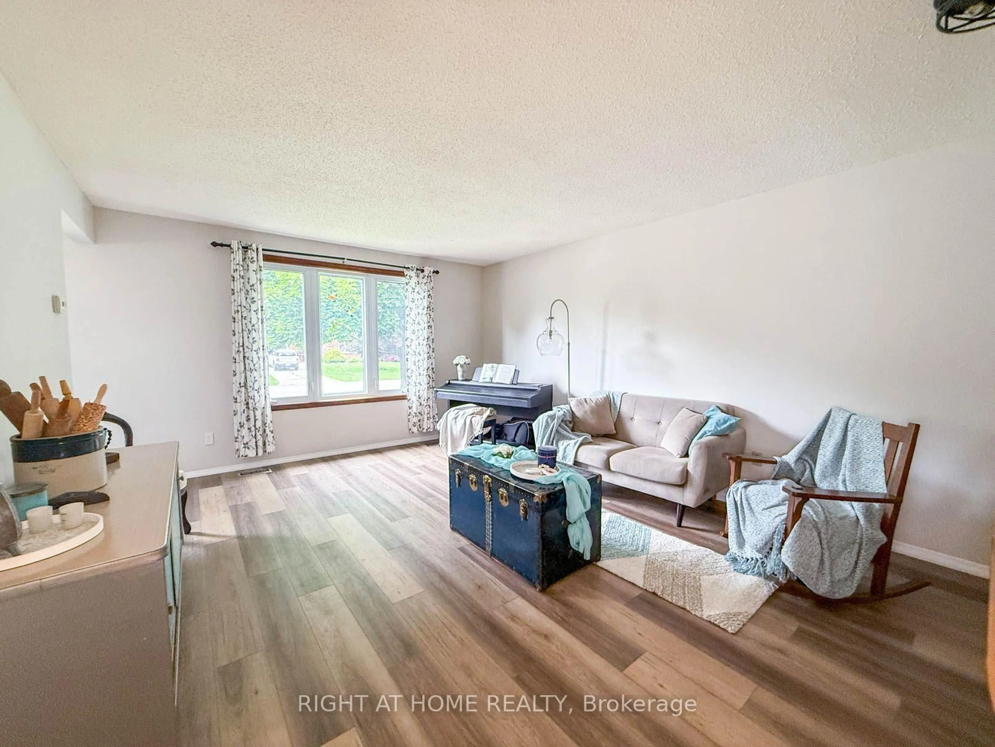 Living room with furniture, wood/laminate floor for 2623 Kaymar Cres, Sarnia Ontario N0N 1C0