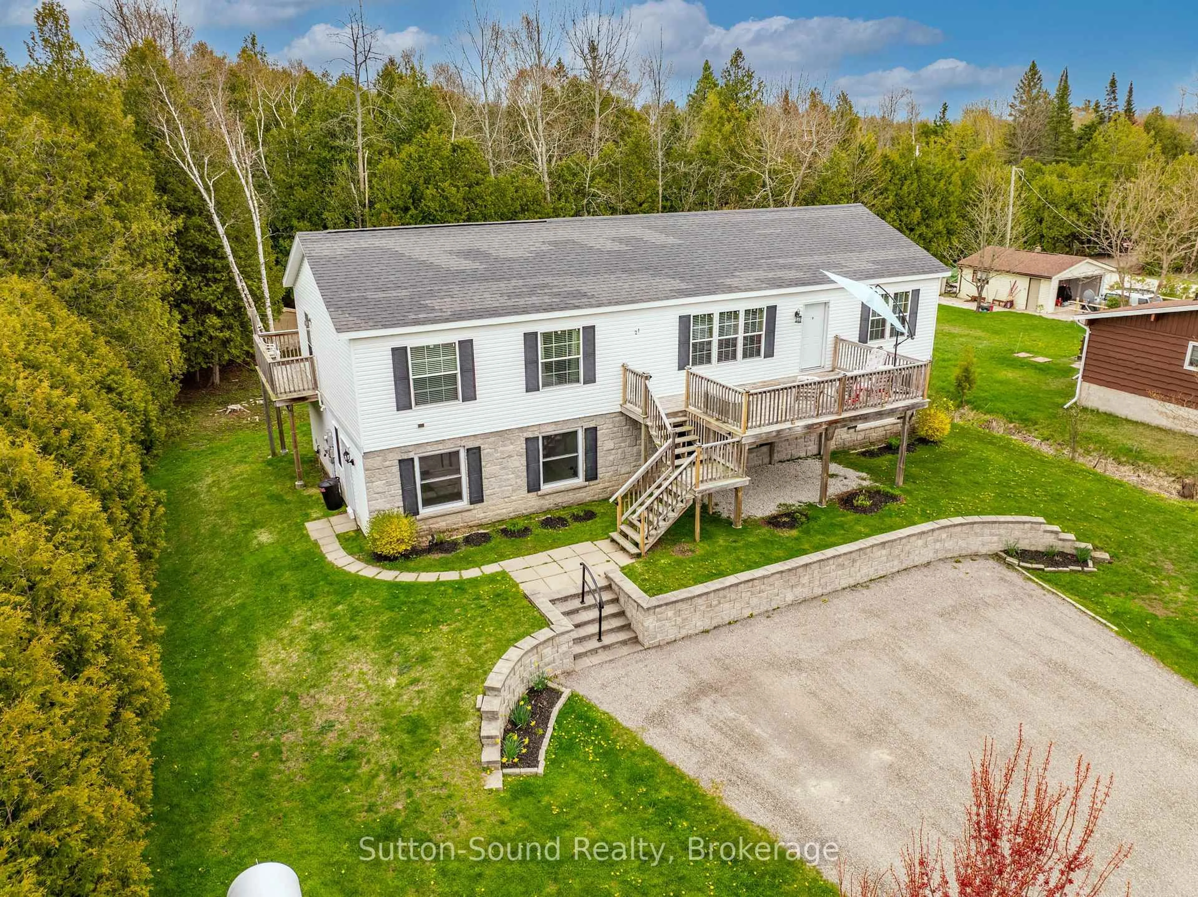 A pic from outside/outdoor area/front of a property/back of a property/a pic from drone, unknown for 21 Cardinal Ave, South Bruce Peninsula Ontario N0H 2T0