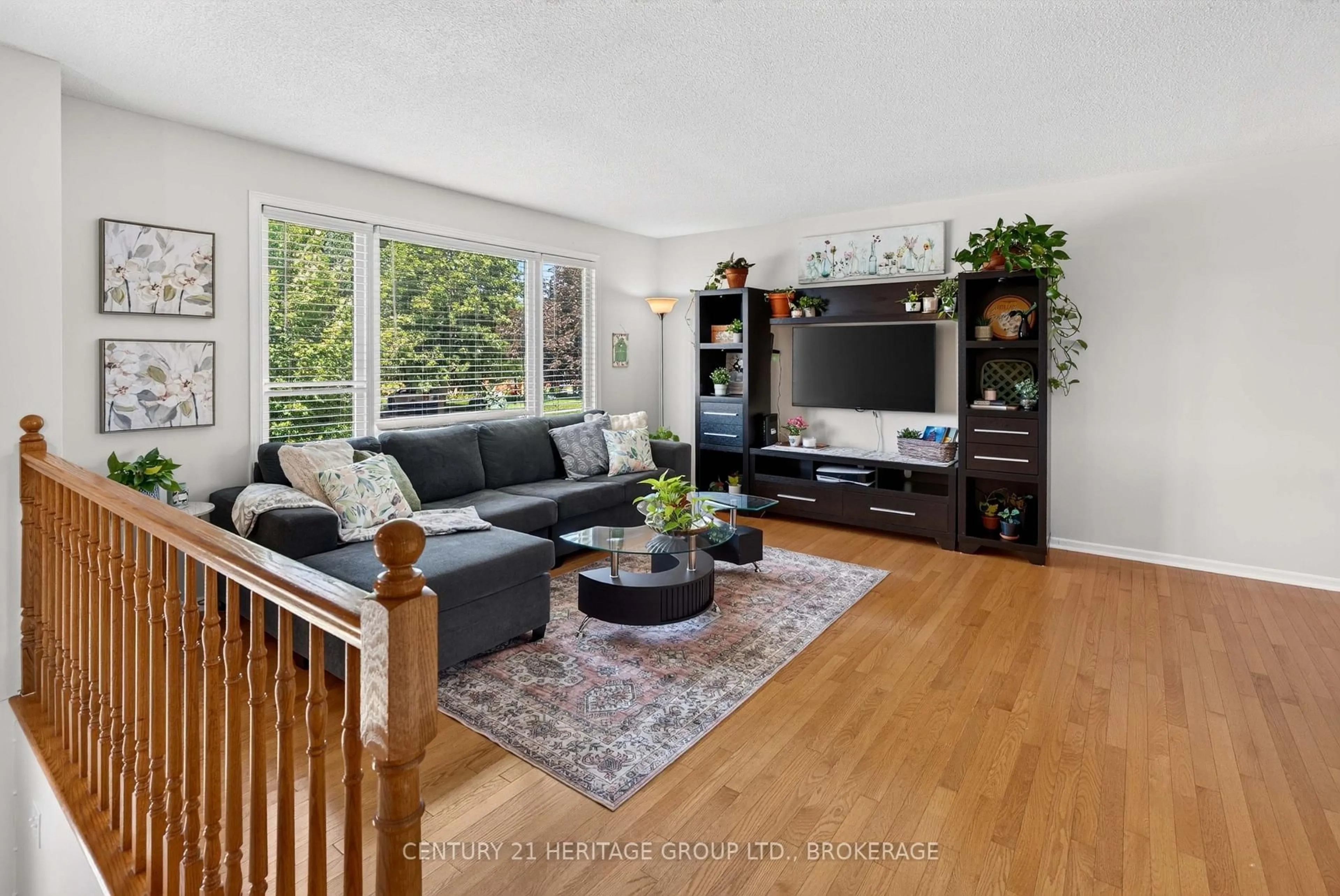 Living room with furniture, wood/laminate floor for 52 Lochinvar Rd, Kingston Ontario K7M 6N8