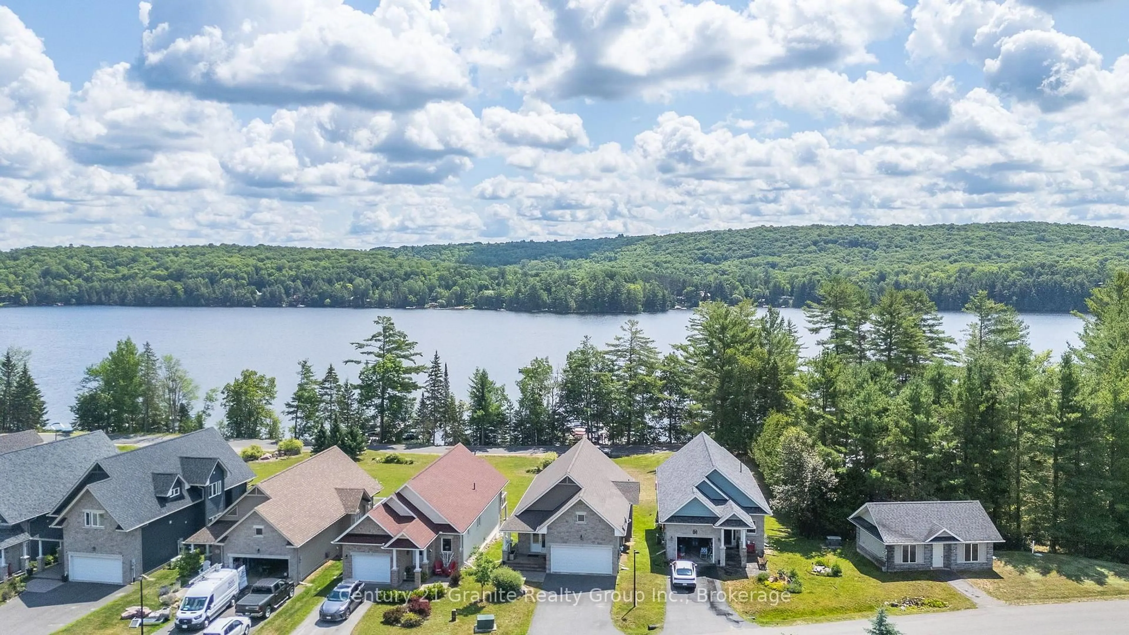 A pic from outside/outdoor area/front of a property/back of a property/a pic from drone, water/lake/river/ocean view for 17 Webb Circ, Dysart et al Ontario K0M 1S0