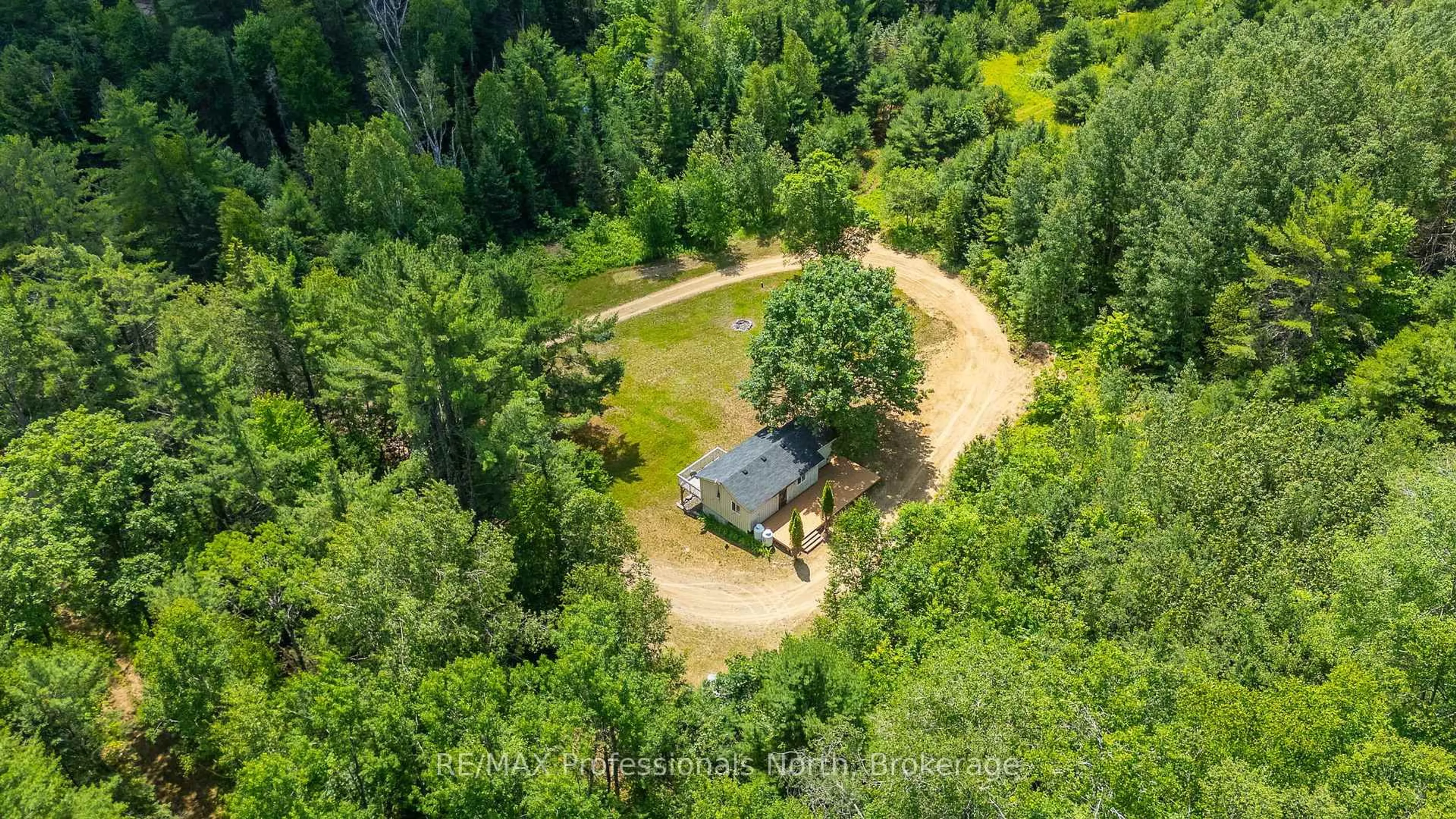 A pic from outside/outdoor area/front of a property/back of a property/a pic from drone, forest/trees view for 1468 Barry Line, Algonquin Highlands Ontario K0M 1J0
