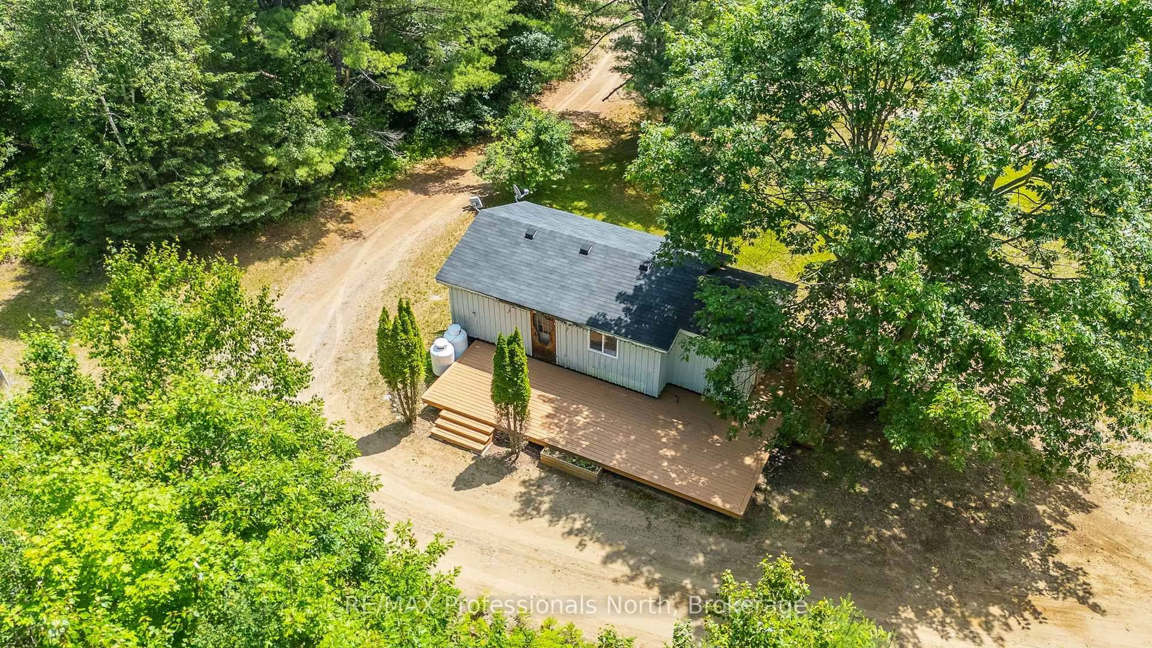 A pic from outside/outdoor area/front of a property/back of a property/a pic from drone, forest/trees view for 1468 Barry Line, Algonquin Highlands Ontario K0M 1J0