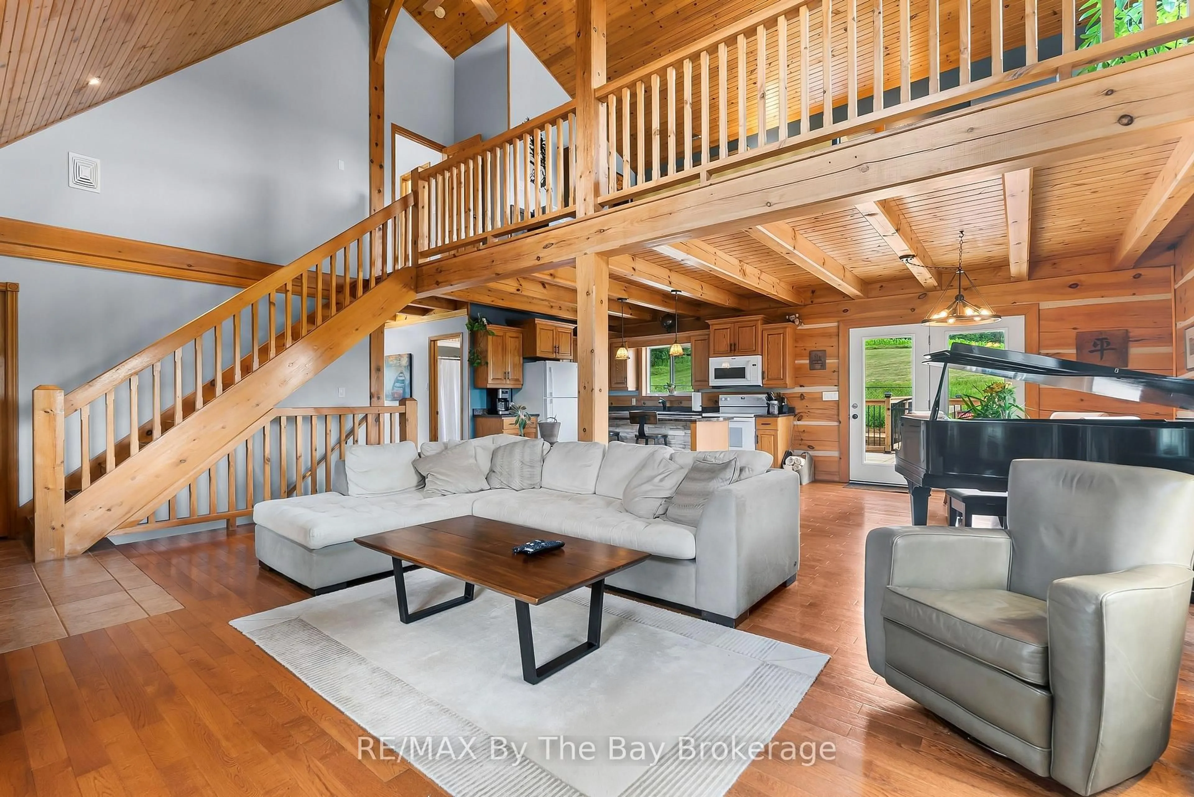 Living room with furniture, wood/laminate floor for 23467 Holland Sydenham Townline, Meaford Ontario N0H 1G0