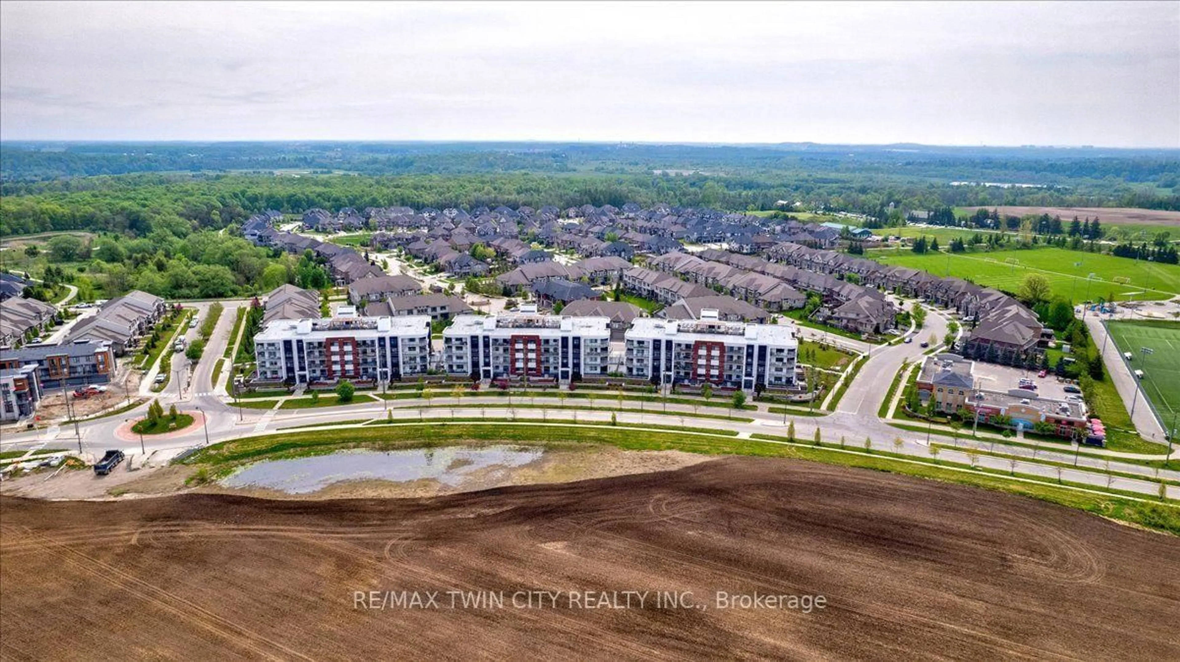 A pic from outside/outdoor area/front of a property/back of a property/a pic from drone, unknown for 247 Grey Silo Rd #307, Waterloo Ontario N2K 0G7