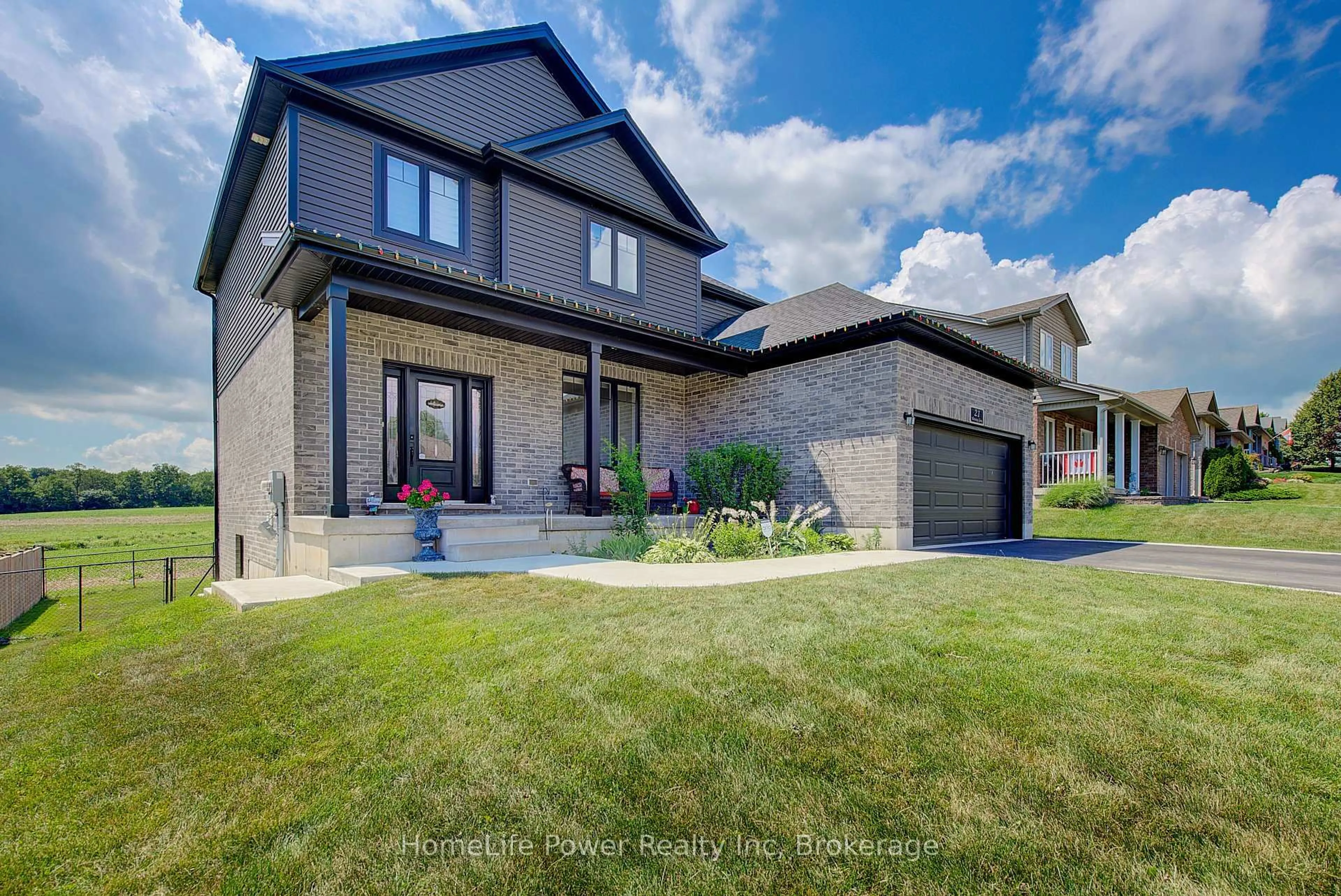 Home with brick exterior material, street for 21 Morning Glory Dr, Tillsonburg Ontario N4G 5S9