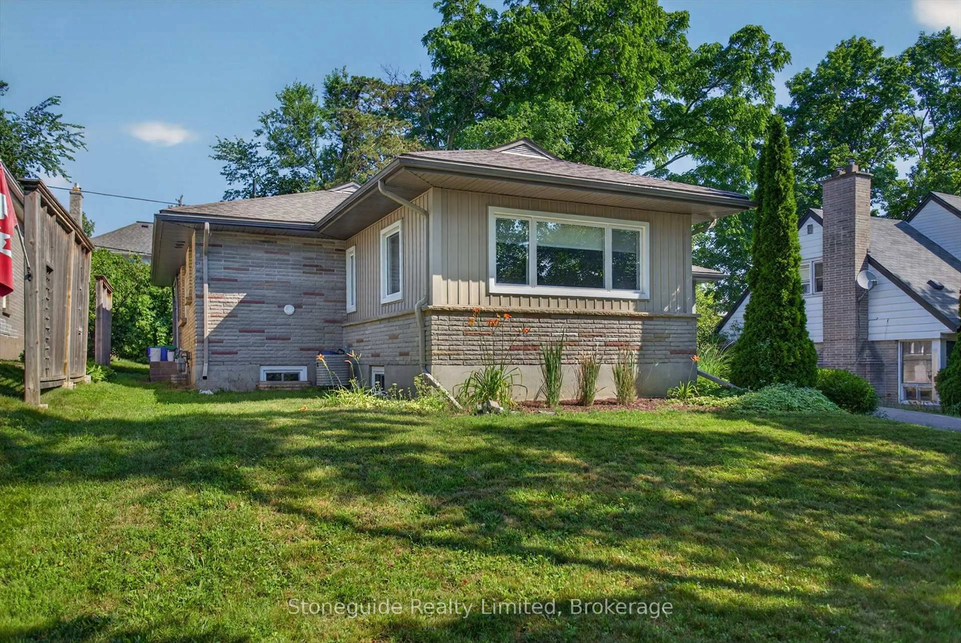 Home with brick exterior material, street for 702 Walkerfield Ave, Peterborough Ontario K9J 4W4