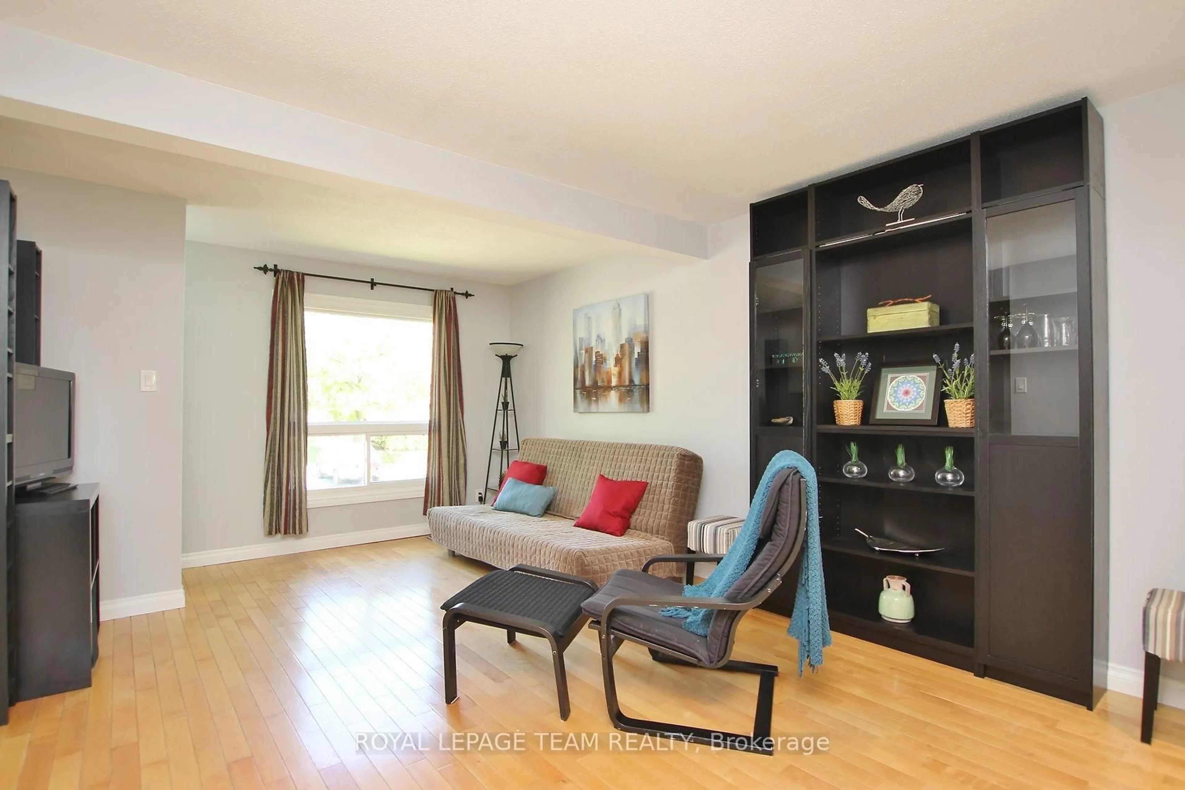 Living room with furniture, wood/laminate floor for 3400 Paul Anka Dr #90, Ottawa Ontario K1V 0C9