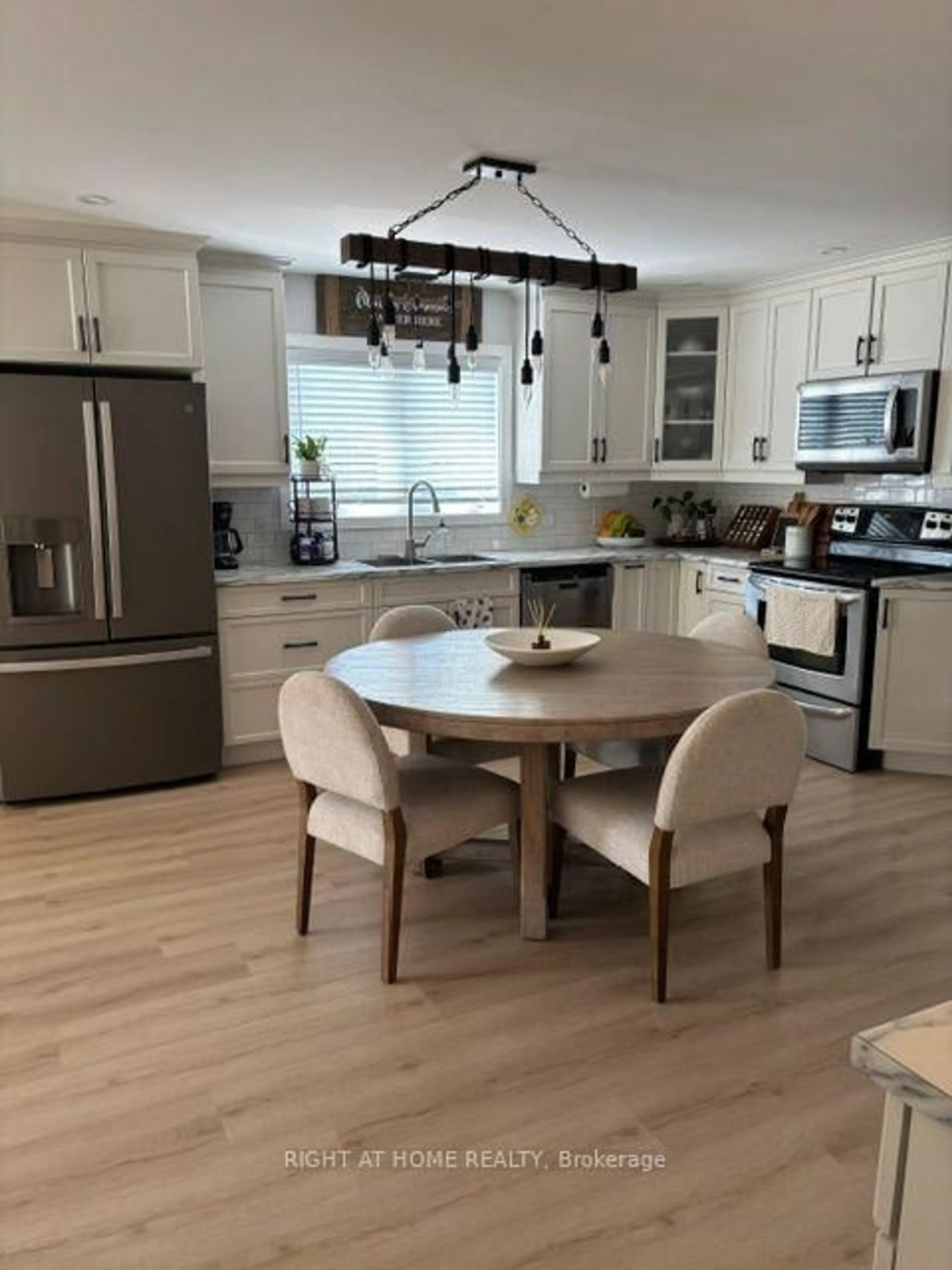 Open concept kitchen, wood/laminate floor for 407 KING St, West Nipissing Ontario P2B 3C8