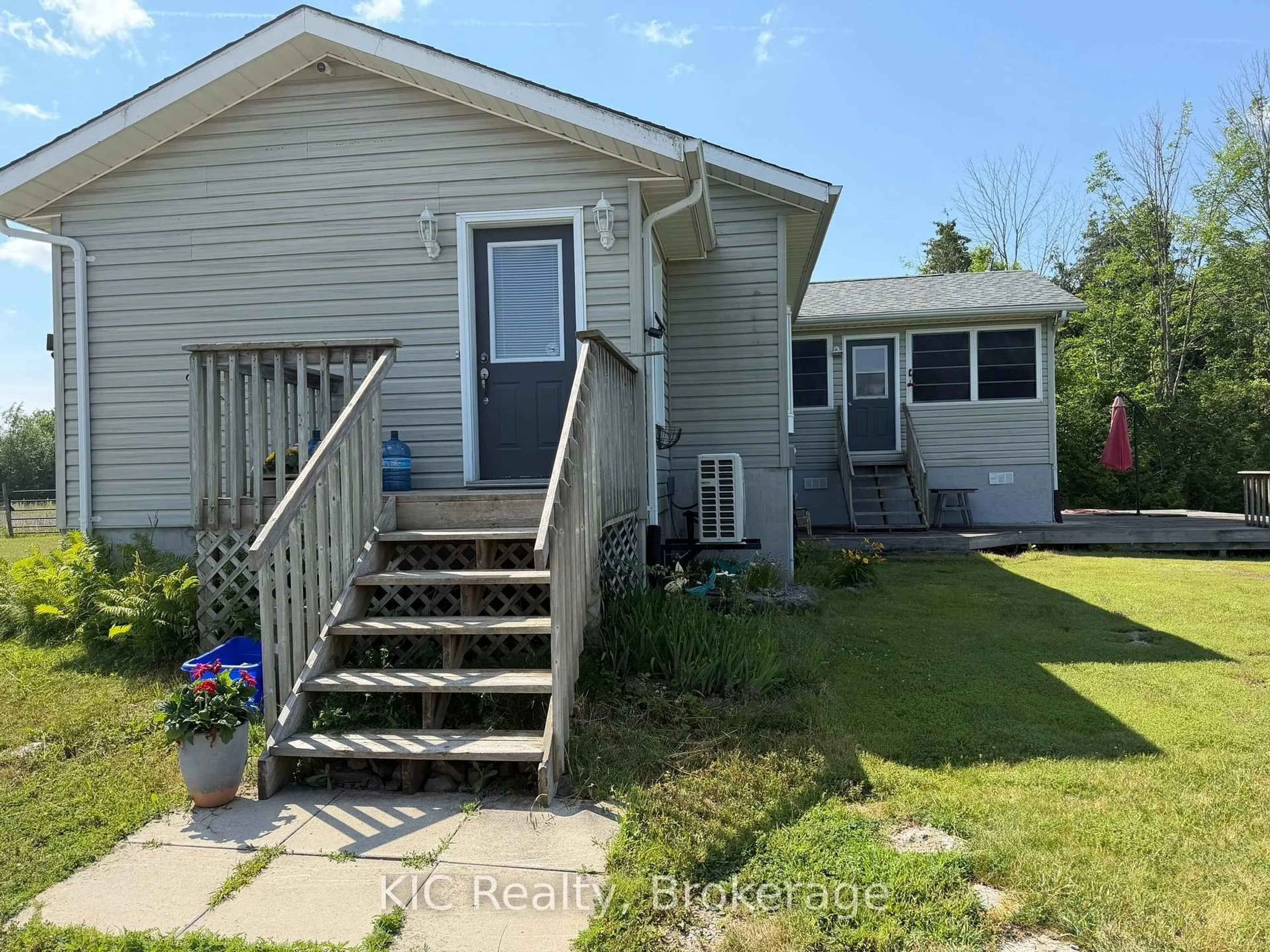 Home with vinyl exterior material, street for 221 Jones Rd, Madoc Ontario K0K 2K0