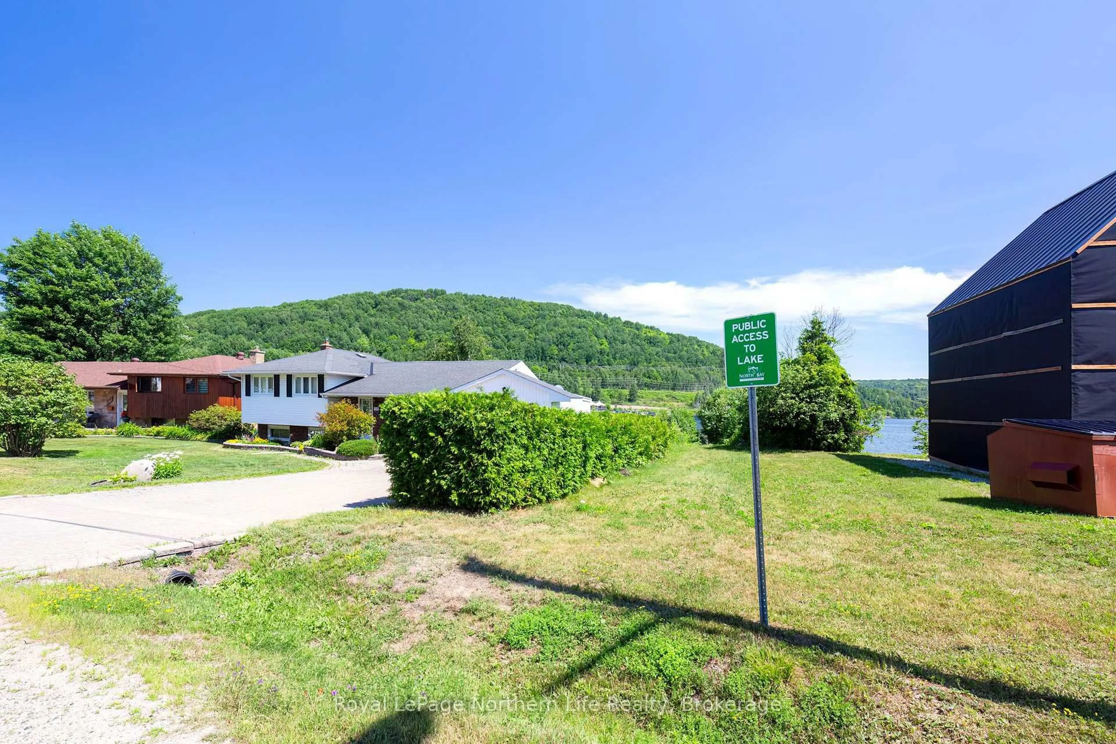 A pic from outside/outdoor area/front of a property/back of a property/a pic from drone, water/lake/river/ocean view for 131 Coreen Cres, North Bay Ontario P1A 3G1