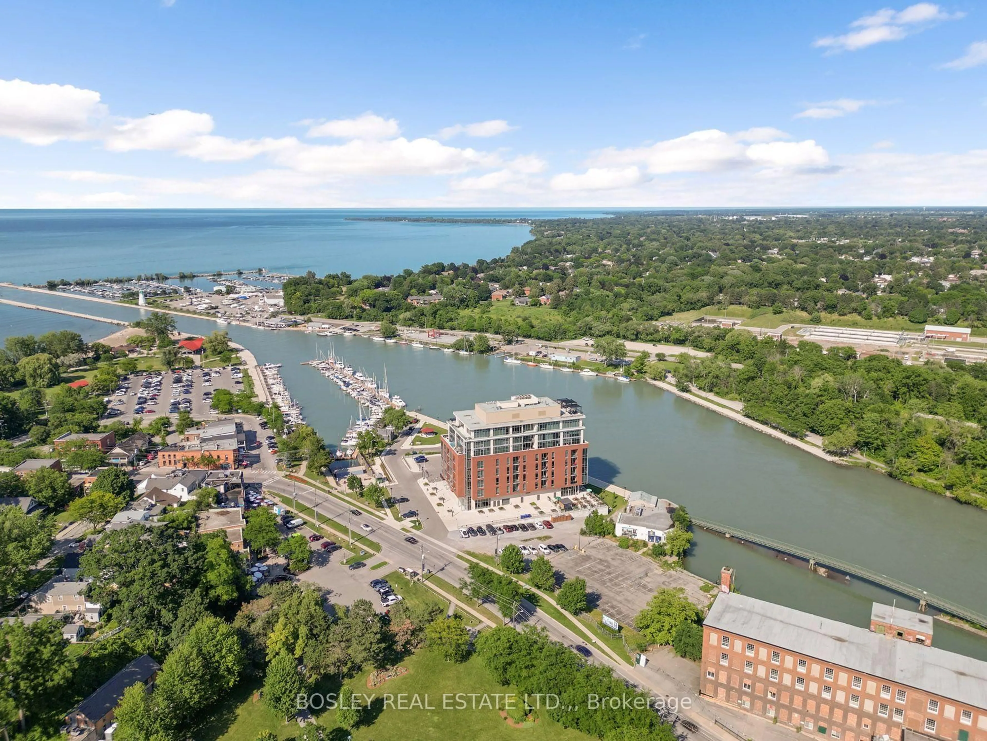 A pic from outside/outdoor area/front of a property/back of a property/a pic from drone, water/lake/river/ocean view for 57 Lakeport Rd #307, St. Catharines Ontario L2N 4P6