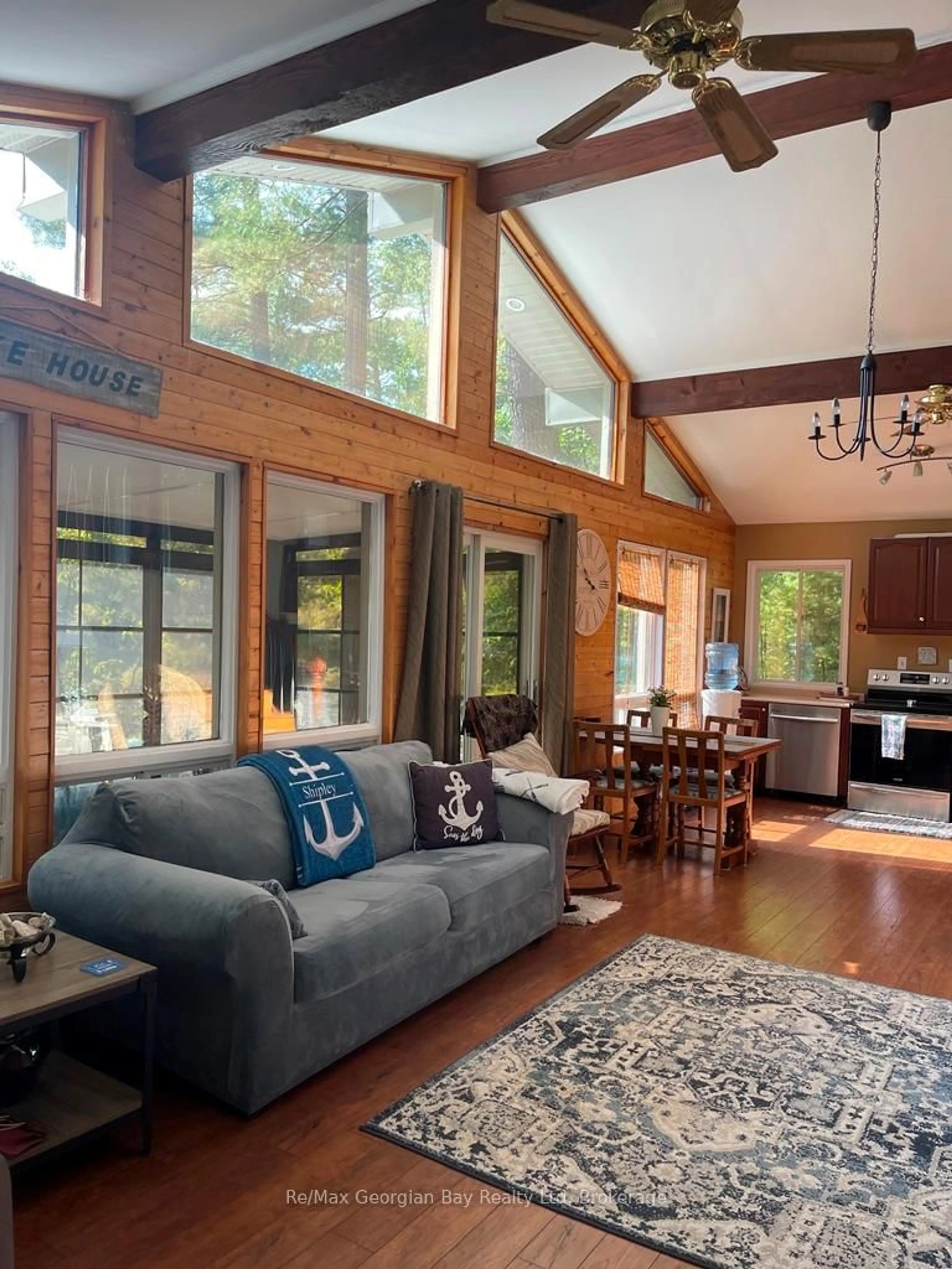 Living room with furniture, wood/laminate floor for 4SR406 SEVERN RIVER Rte, Muskoka Lakes Ontario L0K 1E0