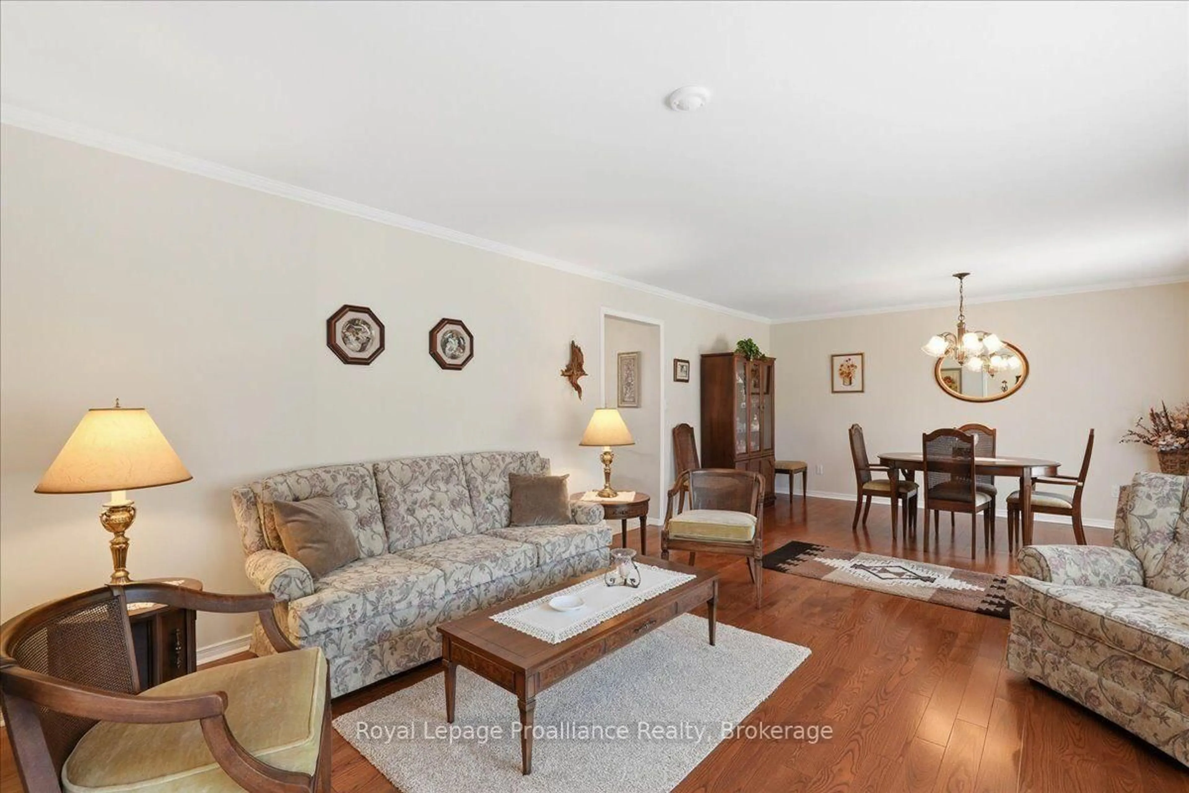 Living room with furniture, wood/laminate floor for 81 Old Troy Rd, Tweed Ontario K0K 3J0