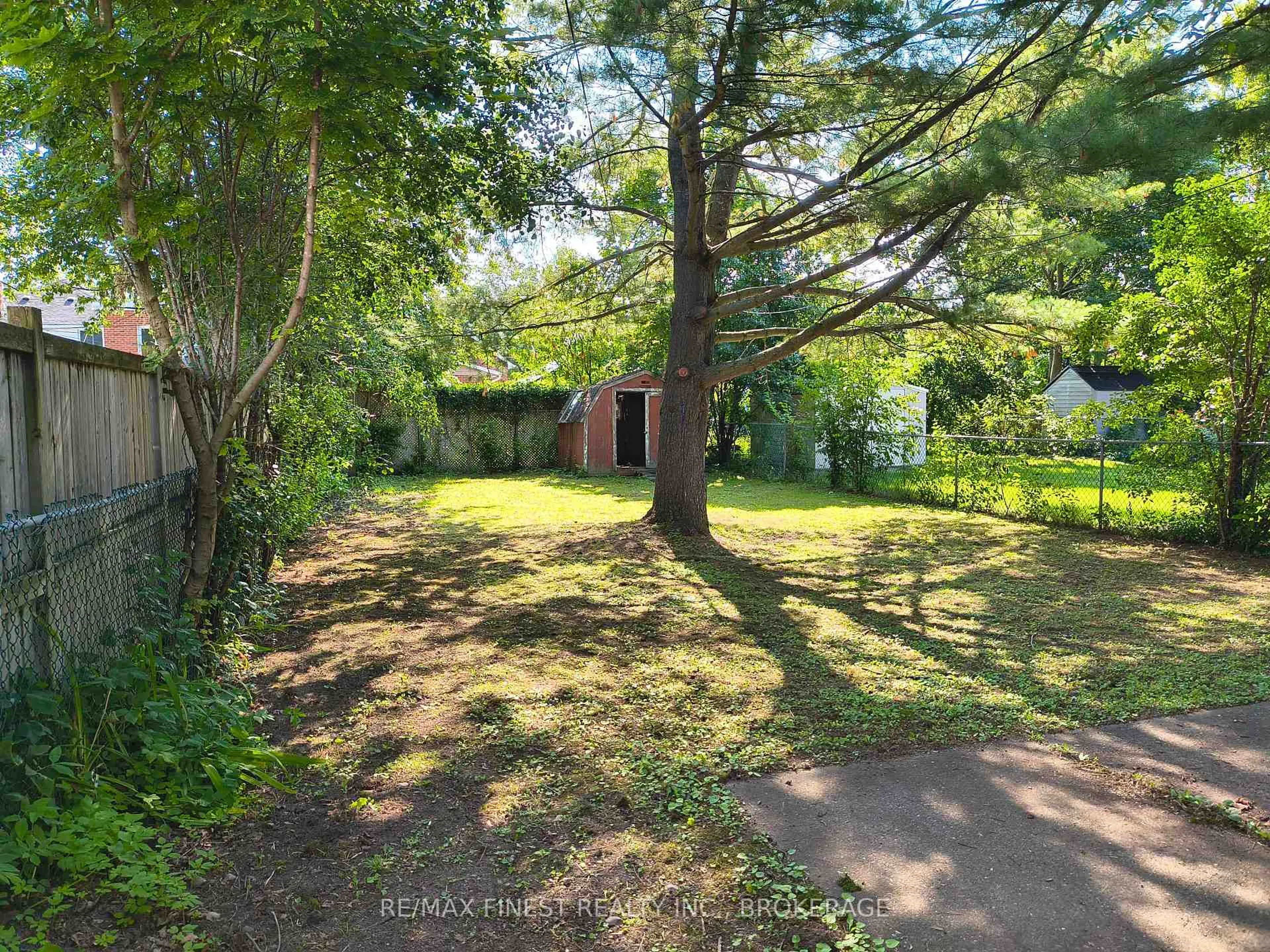 A pic from outside/outdoor area/front of a property/back of a property/a pic from drone, forest/trees view for 309 College St, Kingston Ontario K7L 4M3