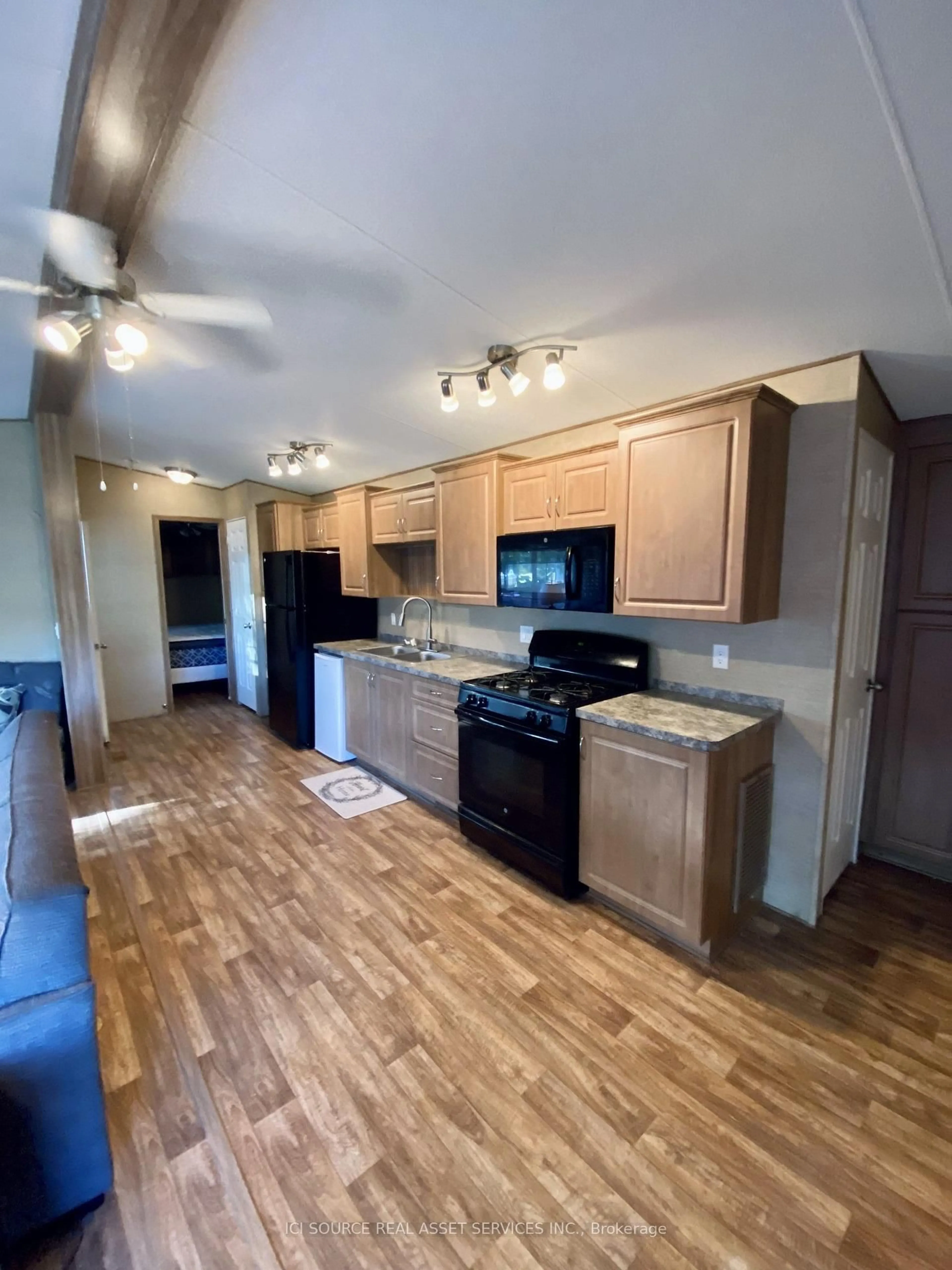 Open concept kitchen, wood/laminate floor for 486 County Road 18 #DDCB18, Prince Edward County Ontario K0K 1P0