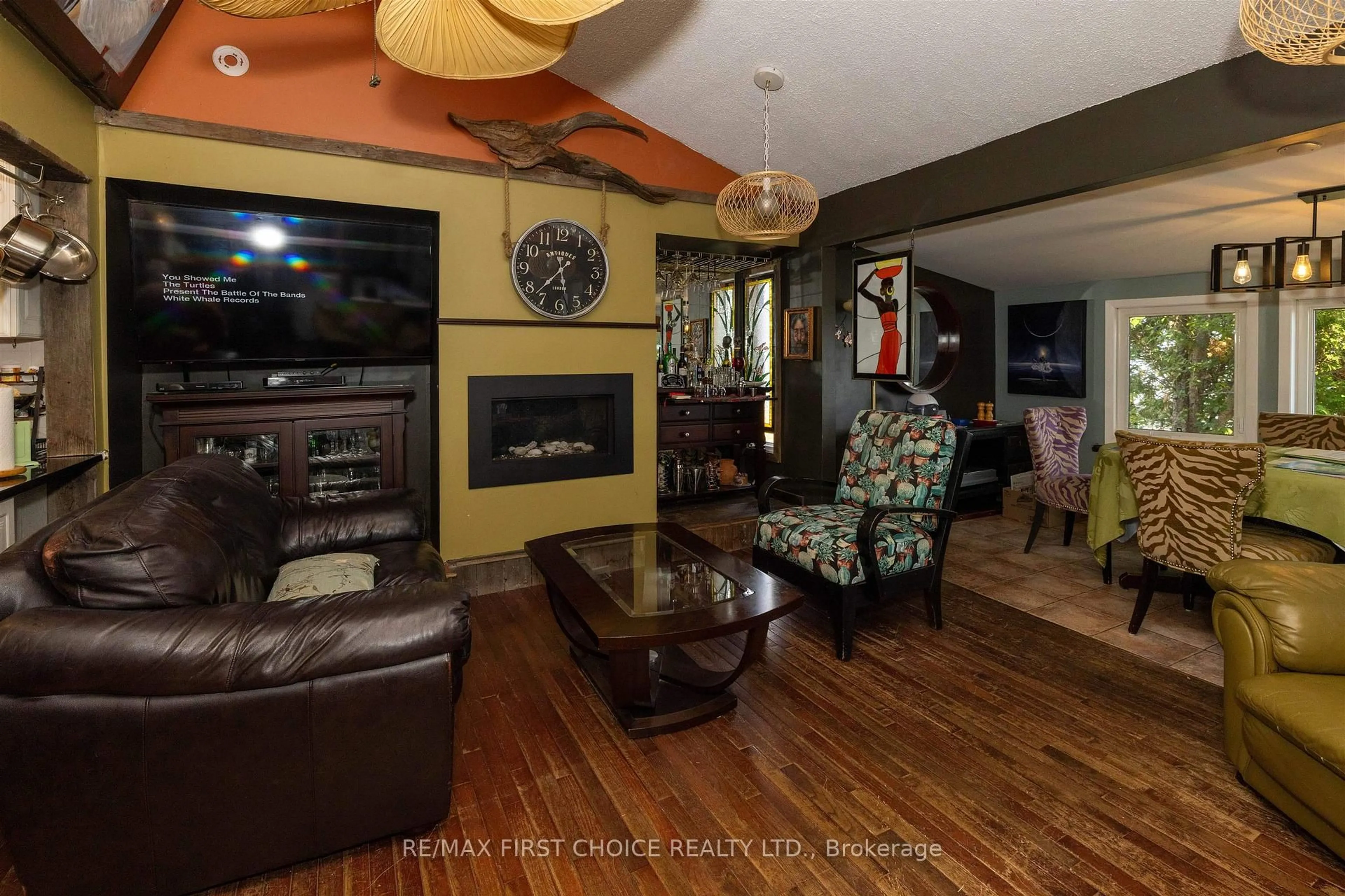 Living room with furniture, wood/laminate floor for 1185 Sunrise Beach Rd, Shuniah Ontario P7A 0Z5