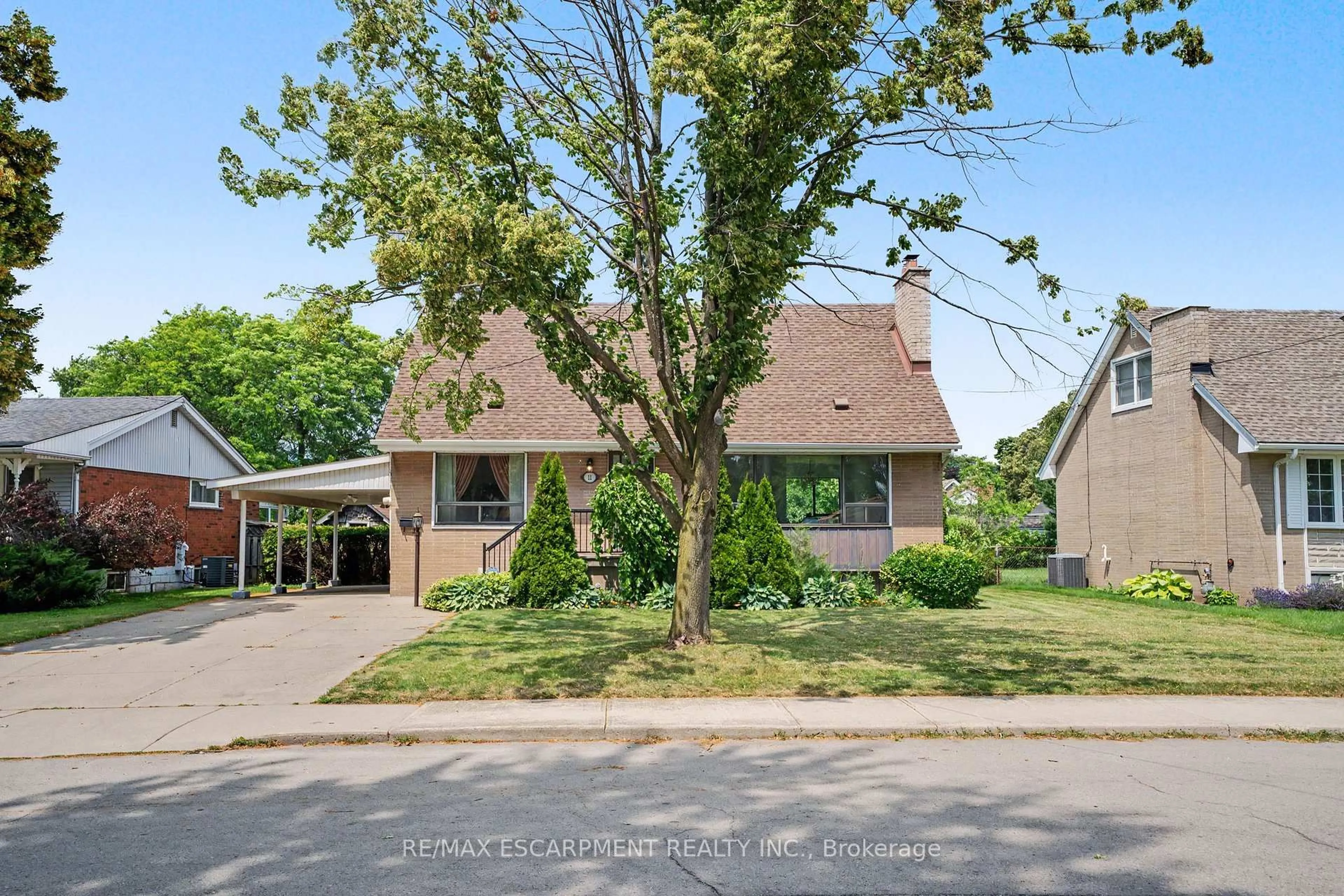 Home with brick exterior material, street for 11 Marshall Ave, Hamilton Ontario L8T 1W9