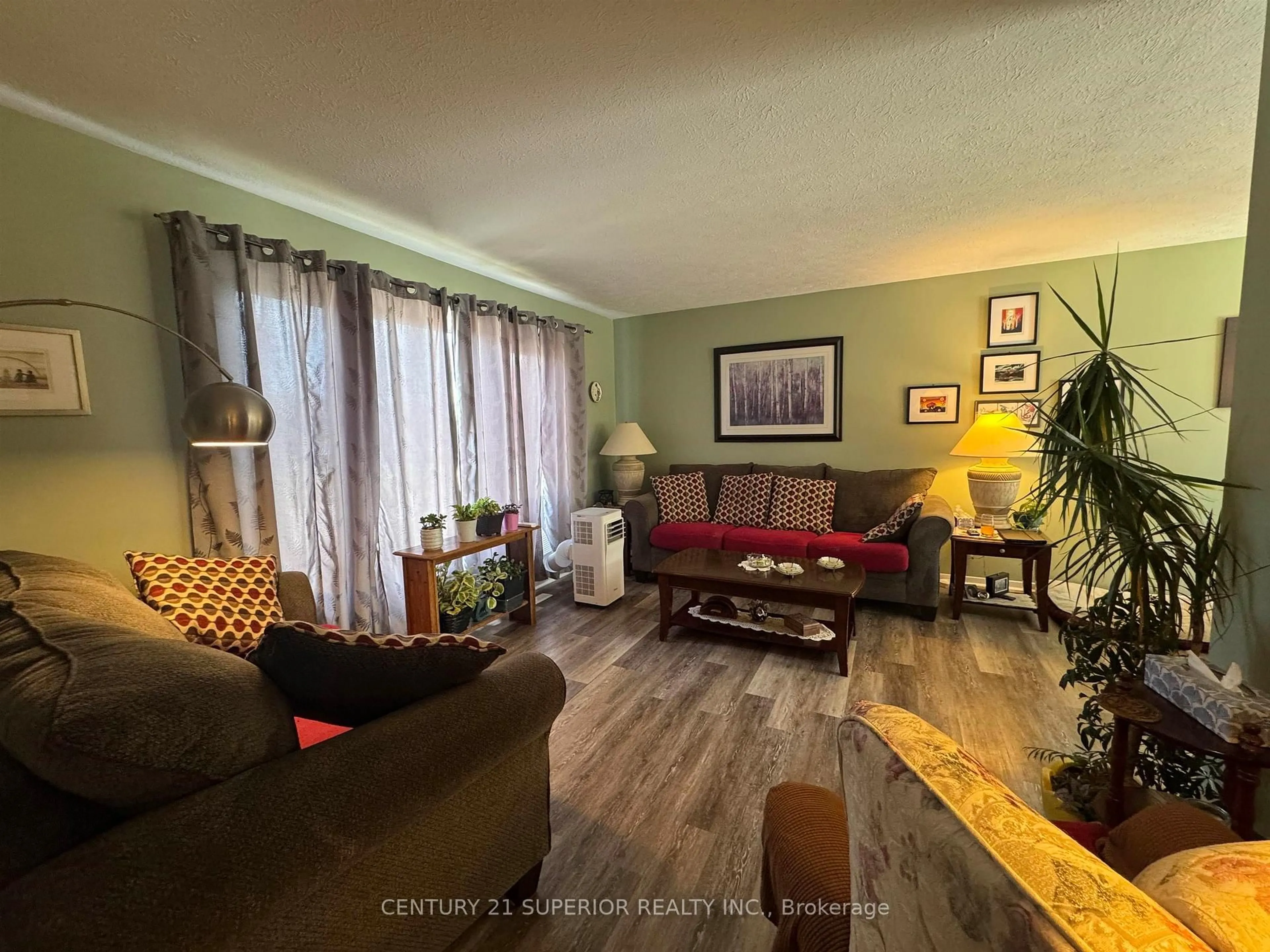 Living room with furniture, wood/laminate floor for 13 Moose Dr, Manitouwadge Ontario P0T 2C0