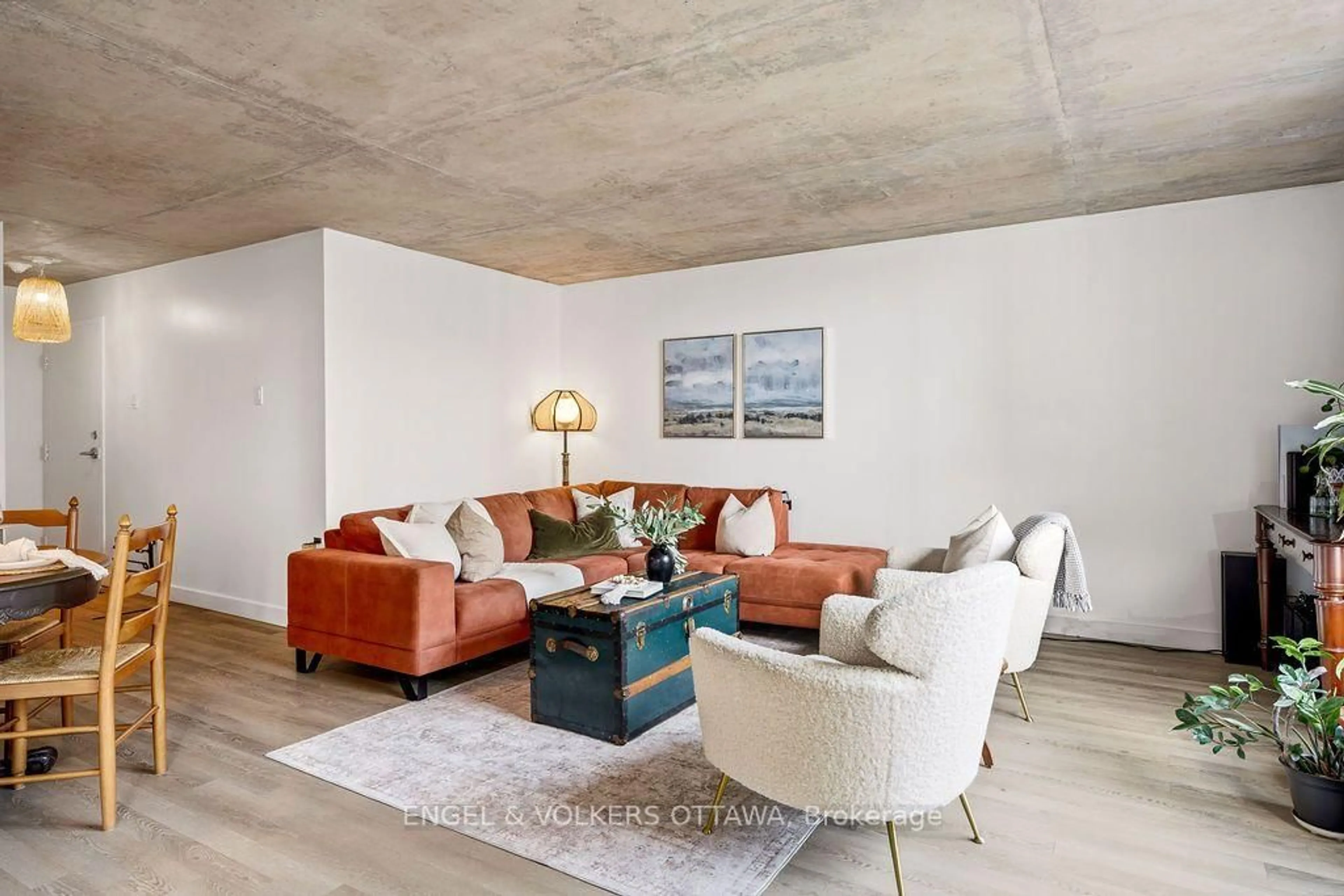 Living room with furniture, cement floor for 475 Laurier Ave #1602, Ottawa Ontario K1R 7X1