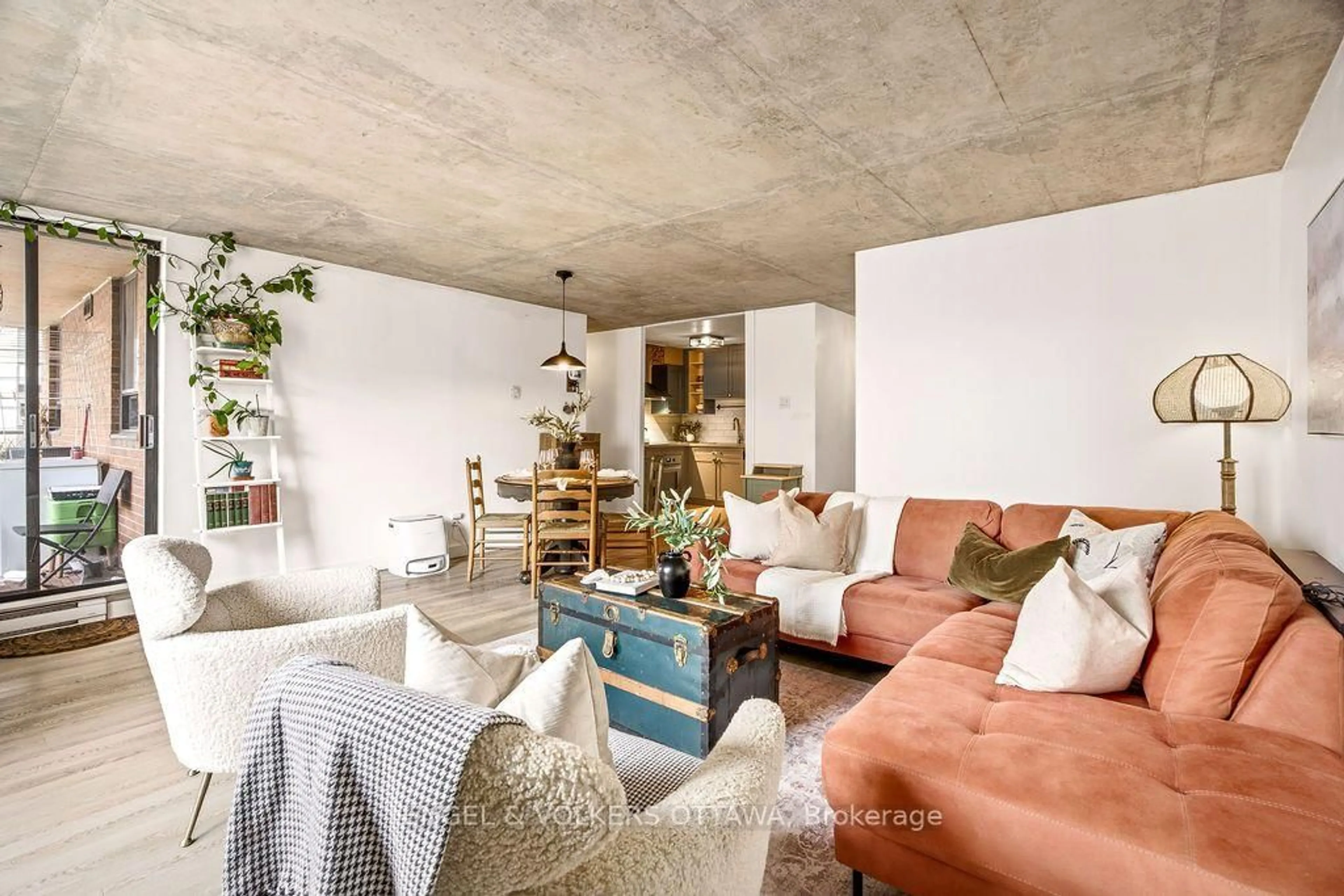 Living room with furniture, cement floor for 475 Laurier Ave #1602, Ottawa Ontario K1R 7X1