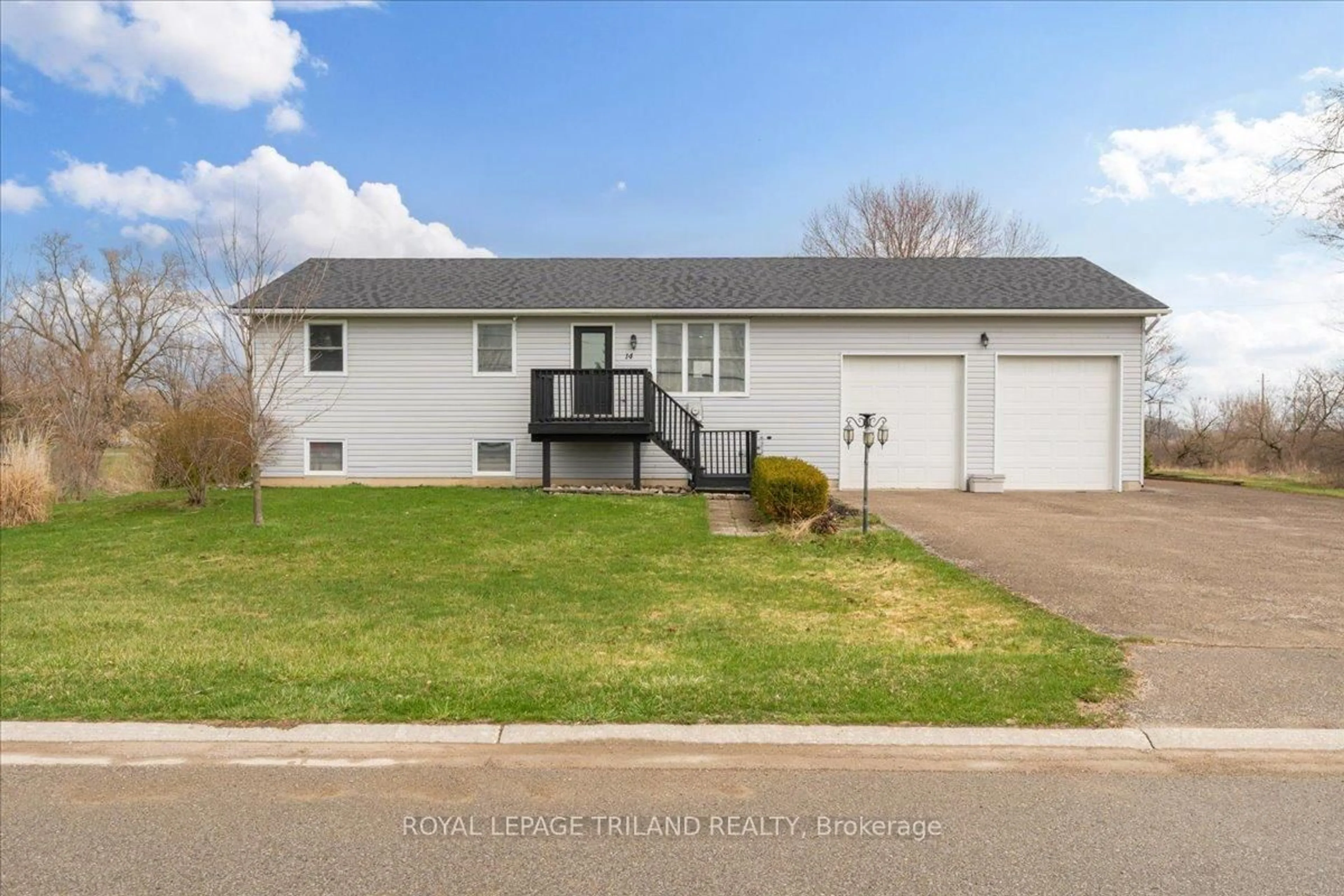 Home with vinyl exterior material, street for 14 Wellington Ave, Southwest Middlesex Ontario N0L 1A0