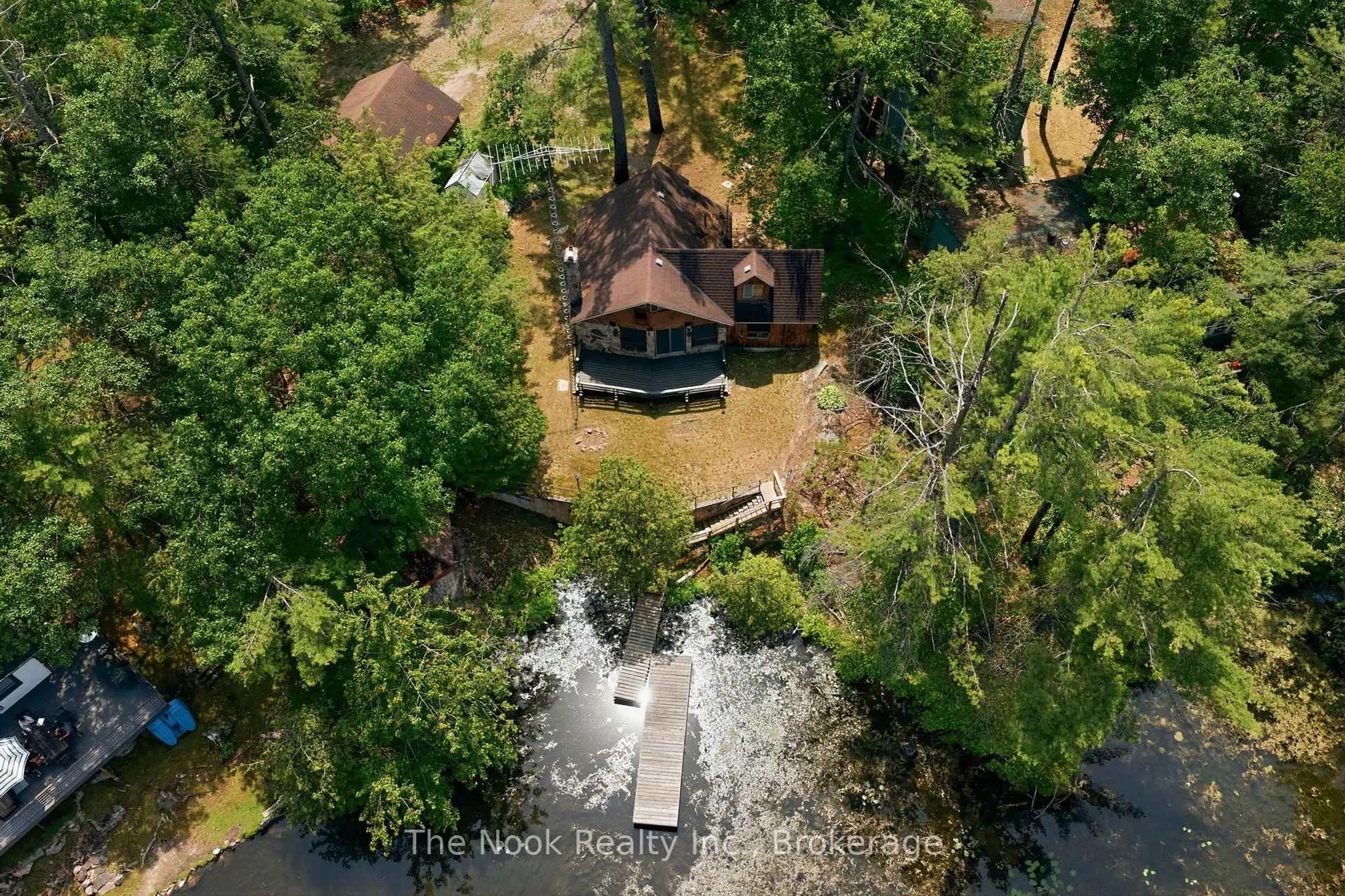 A pic from outside/outdoor area/front of a property/back of a property/a pic from drone, water/lake/river/ocean view for 69 Island Dr, Trent Lakes Ontario K0L 1J0