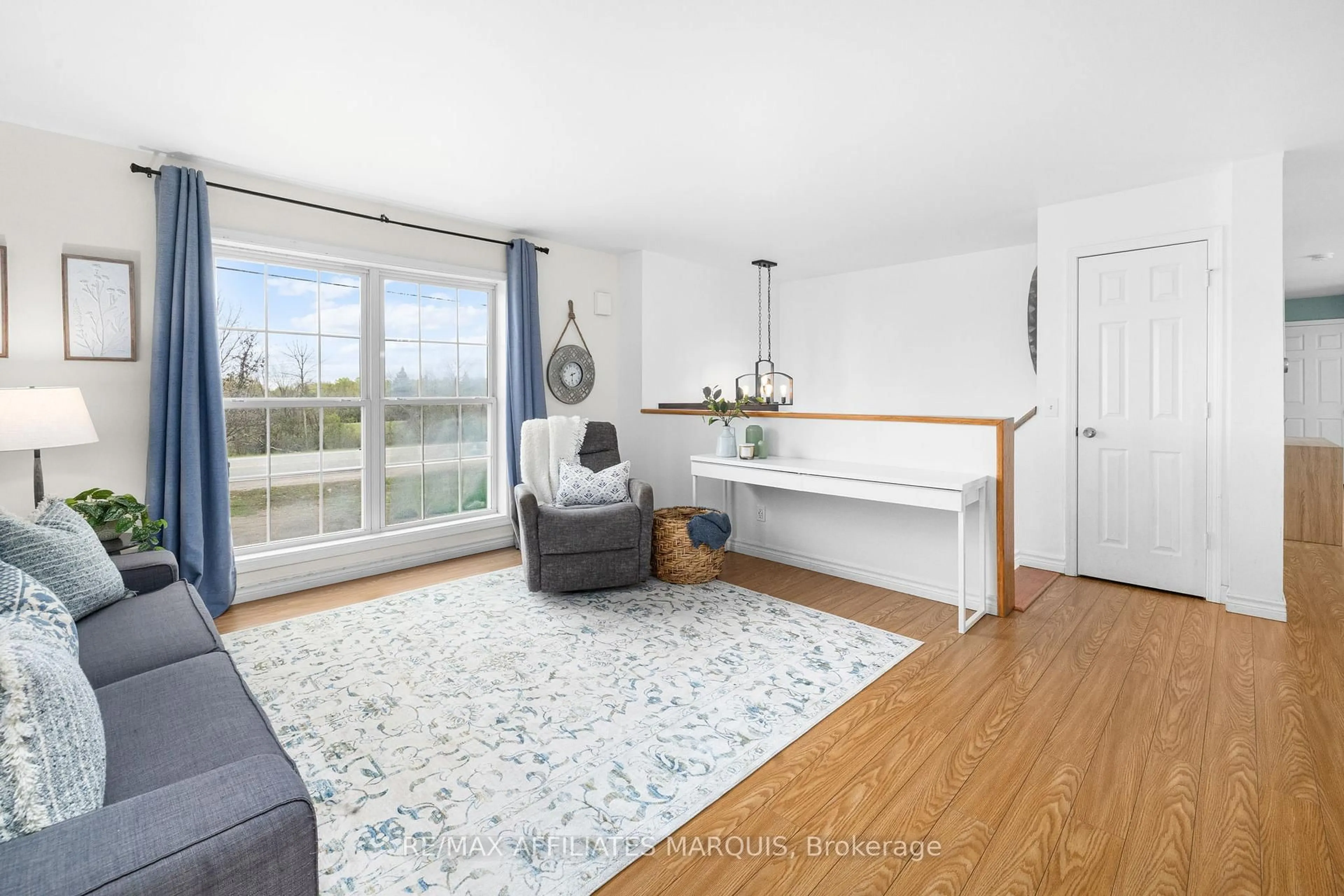 Living room with furniture, wood/laminate floor for 462 Highway 15 Rd, Rideau Lakes Ontario K7A 5B8