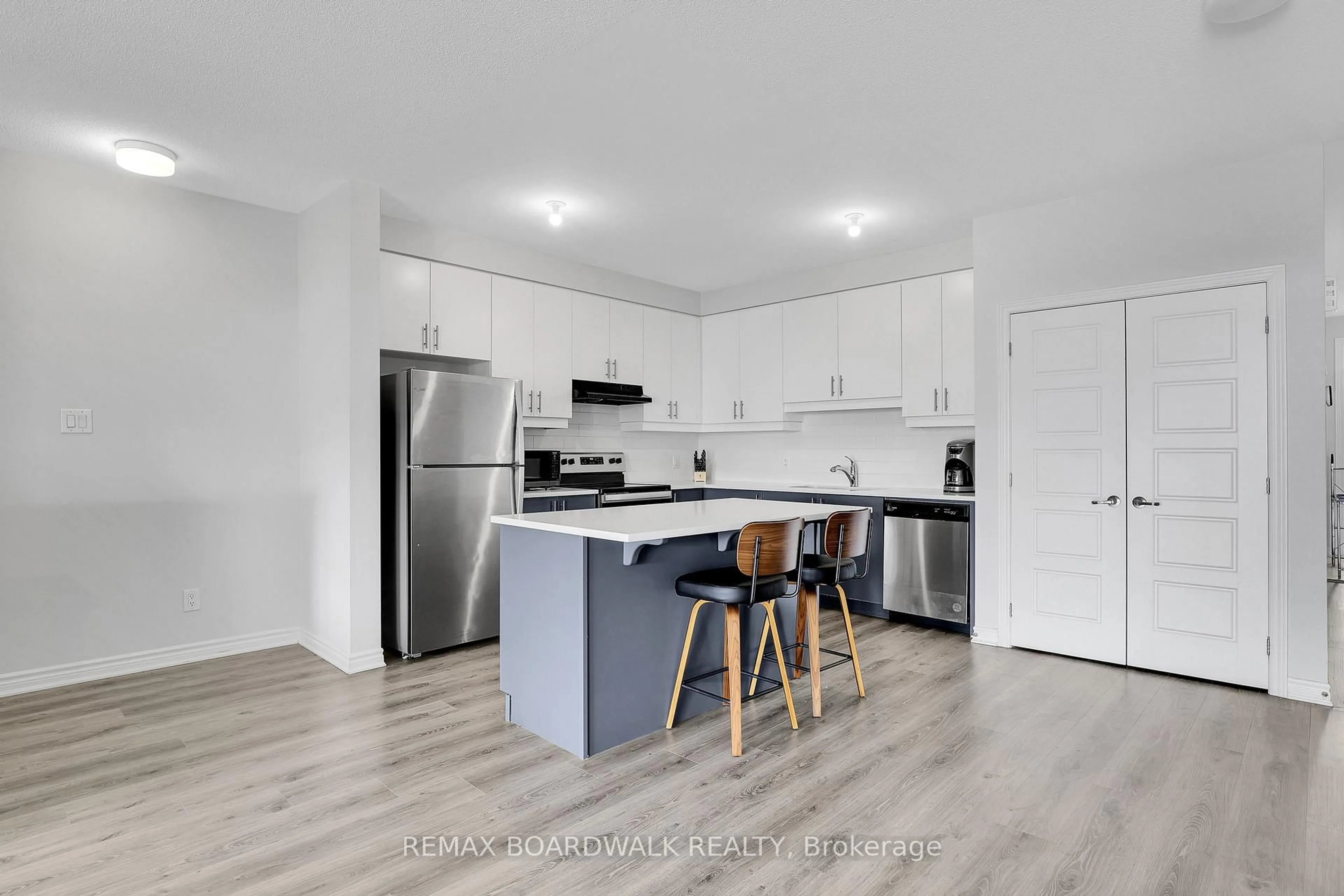 Open concept kitchen, wood/laminate floor for 306 Pilot Private, Ottawa Ontario K2V 0S4