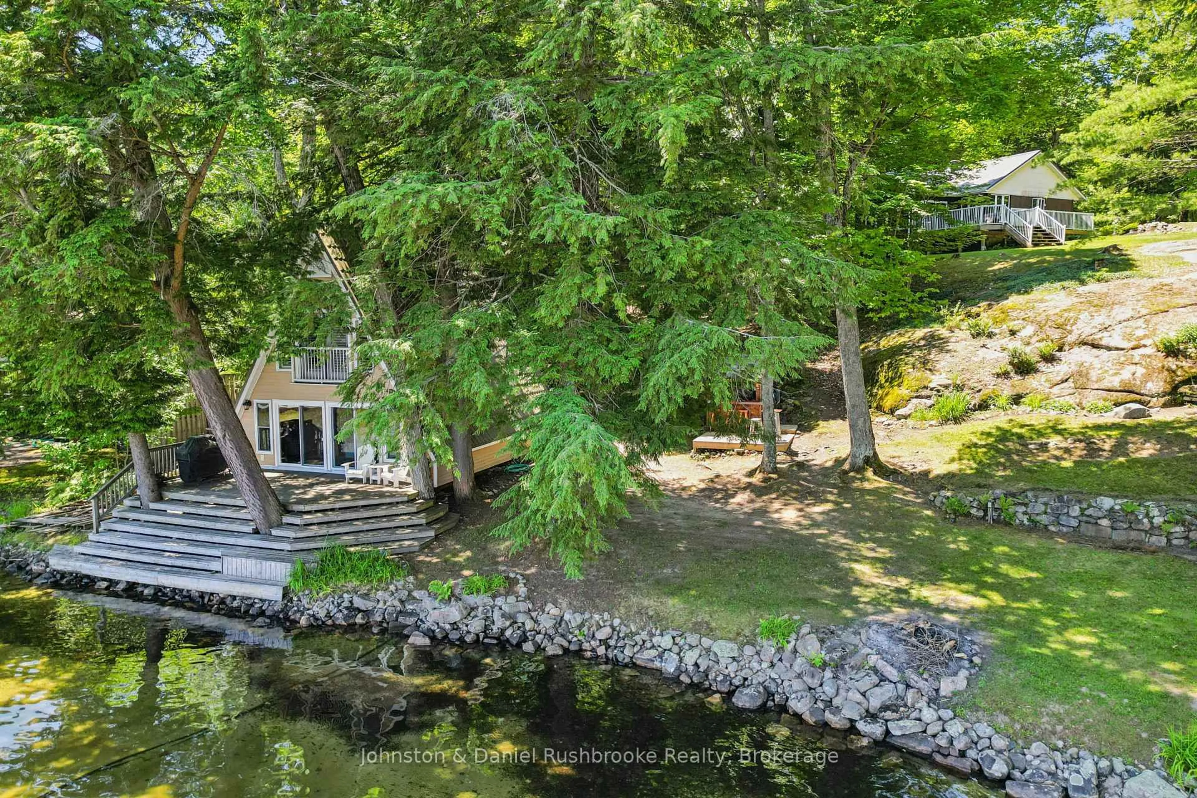 A pic from outside/outdoor area/front of a property/back of a property/a pic from drone, water/lake/river/ocean view for 1155 Stephen Rd #8, Muskoka Lakes Ontario P0B 1J0