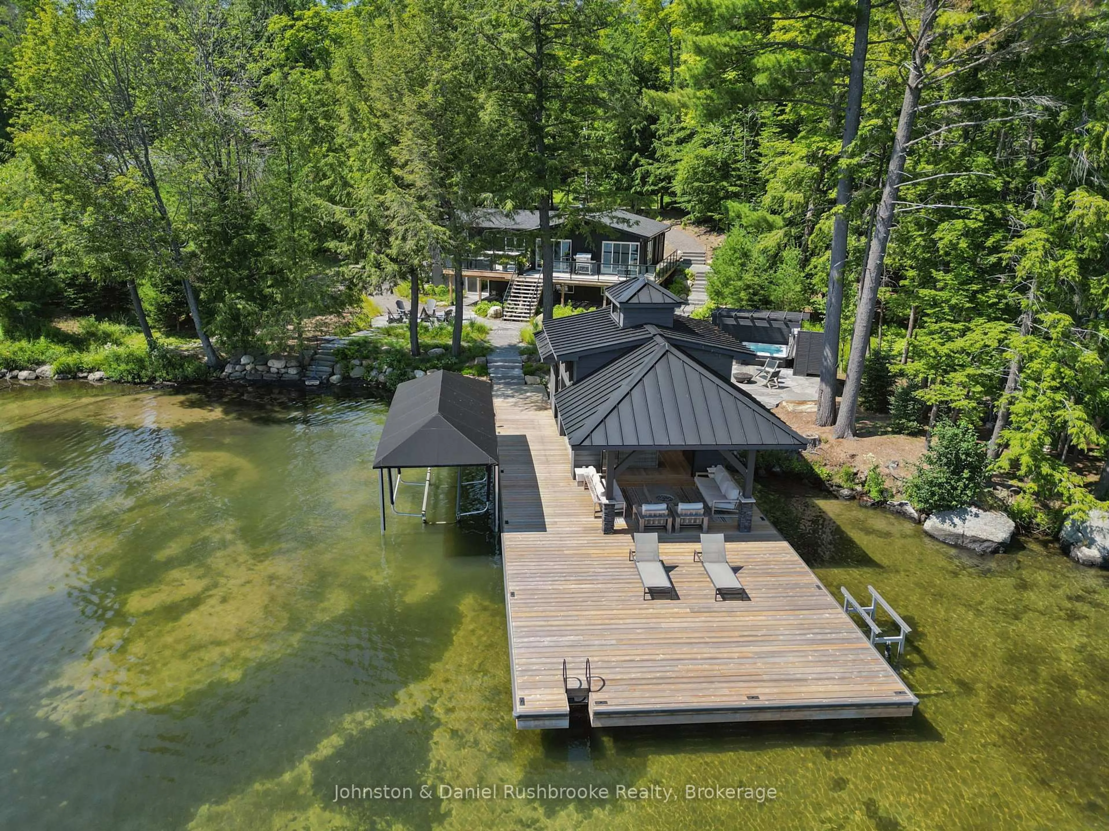 A pic from outside/outdoor area/front of a property/back of a property/a pic from drone, water/lake/river/ocean view for 1125 Big Joe Rd #1, Muskoka Lakes Ontario P0B 1J0