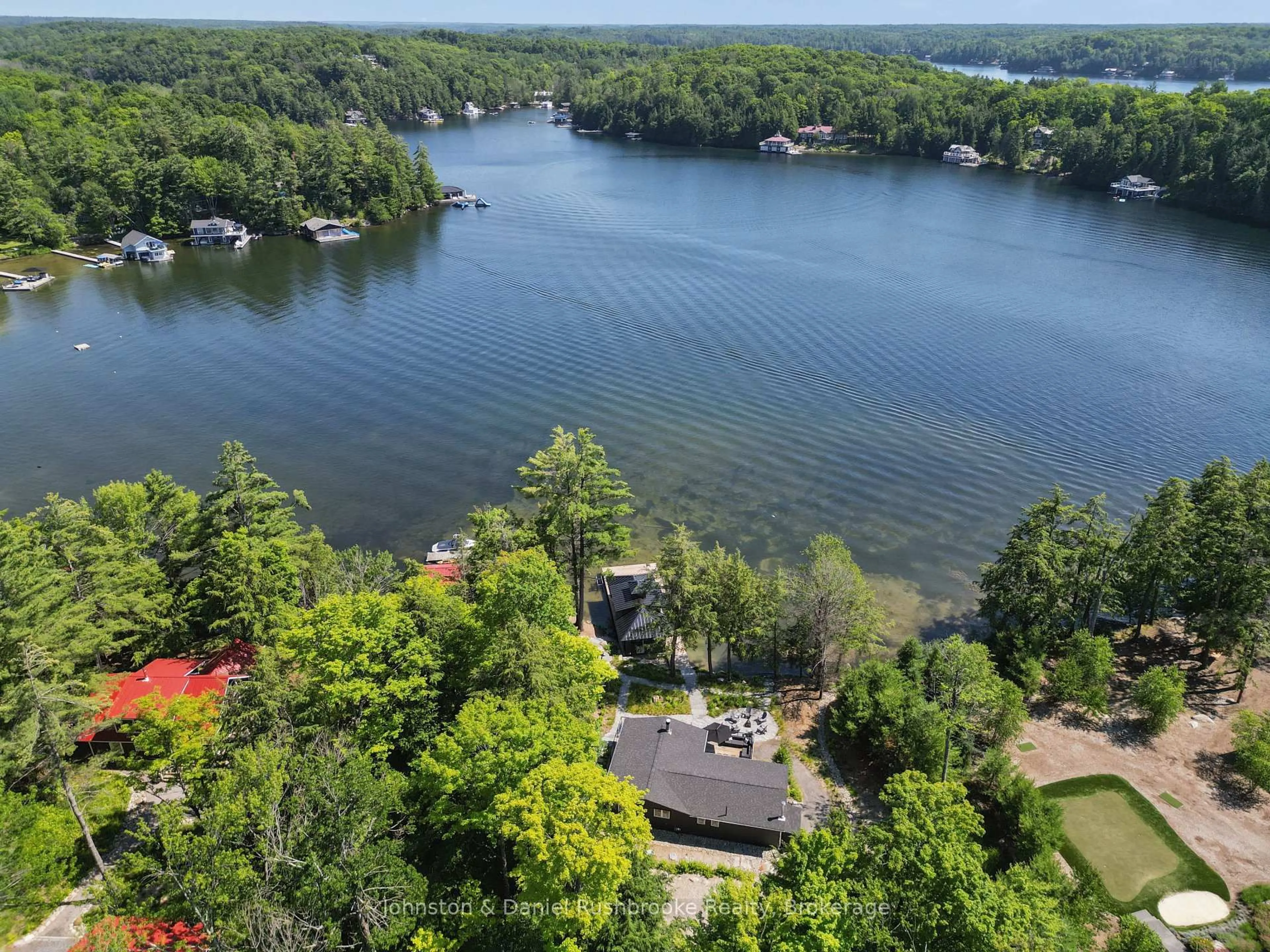 A pic from outside/outdoor area/front of a property/back of a property/a pic from drone, water/lake/river/ocean view for 1125 Big Joe Rd #1, Muskoka Lakes Ontario P0B 1J0