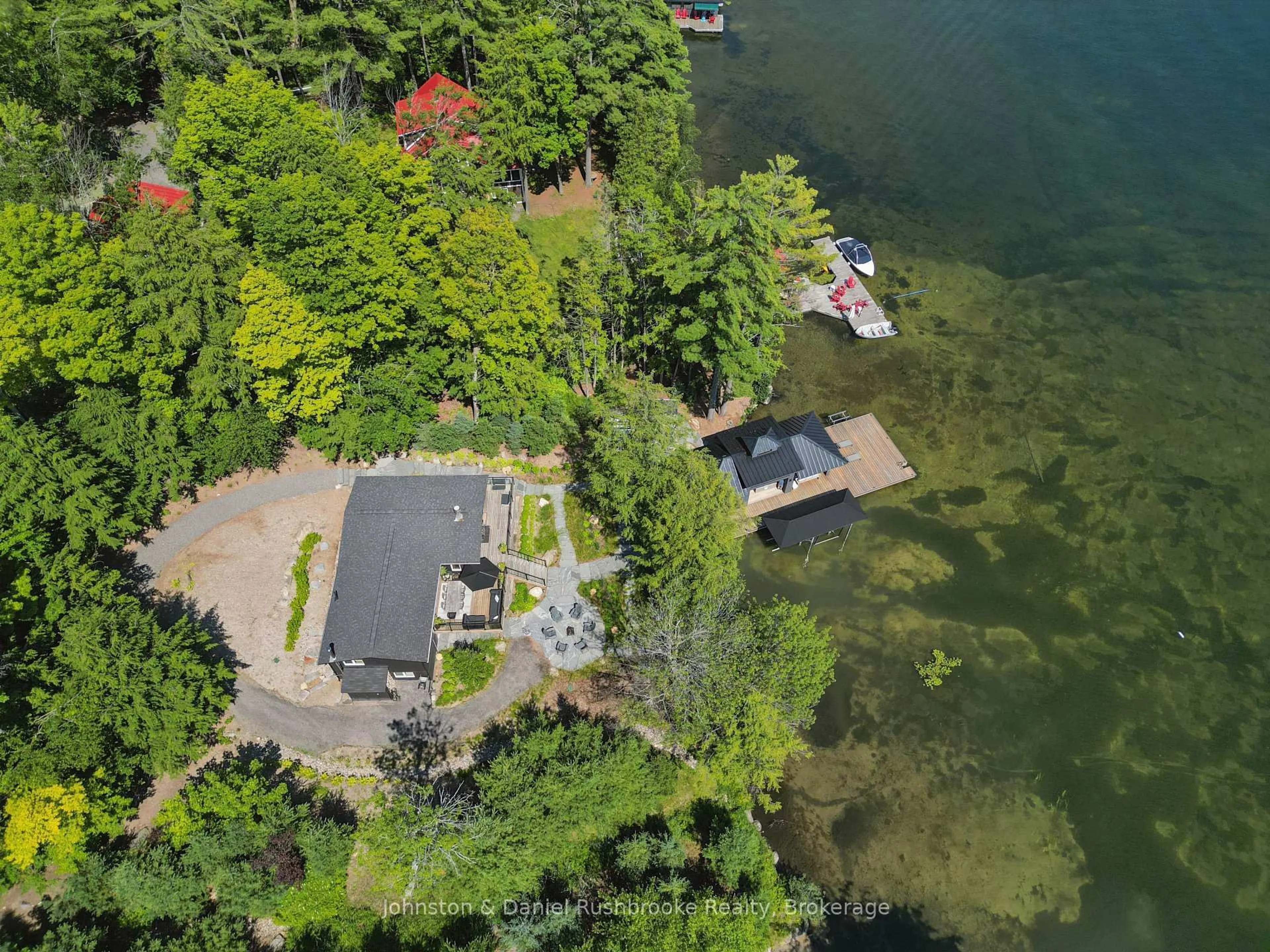 A pic from outside/outdoor area/front of a property/back of a property/a pic from drone, water/lake/river/ocean view for 1125 Big Joe Rd #1, Muskoka Lakes Ontario P0B 1J0