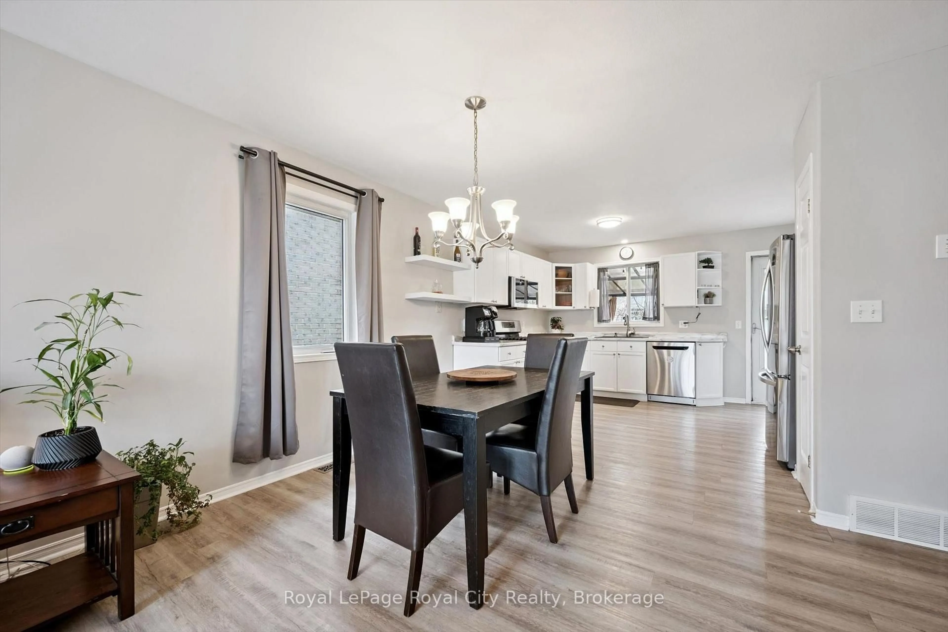 Open concept kitchen, wood/laminate floor for 119 Meadowridge Dr, St. Marys Ontario N4X 1E7